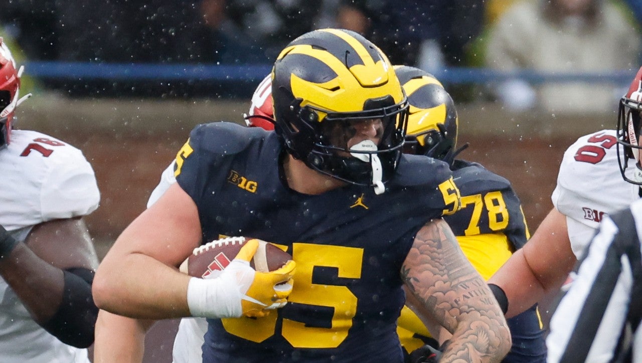 Oct 14, 2023; Ann Arbor, Michigan, USA; Michigan Wolverines defensive lineman Mason Graham (55) runs the ball after he recovers a fumble in the second half against the Indiana Hoosiers at Michigan Stadium.