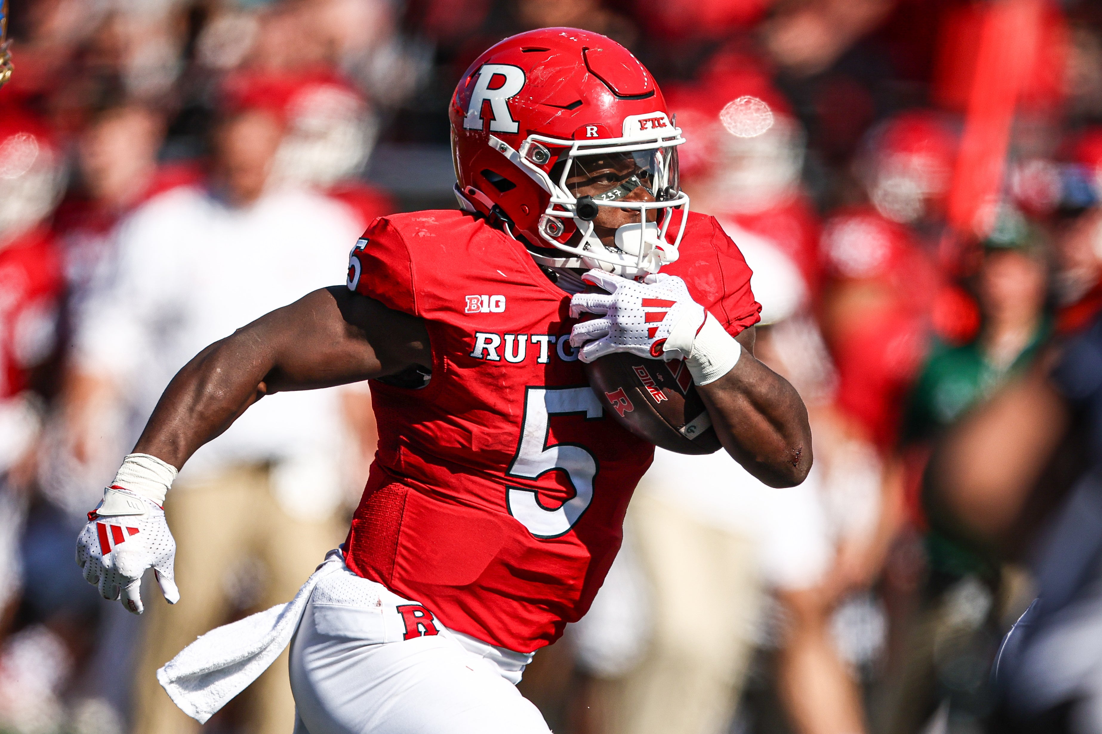 Oct 19, 2024; Piscataway, New Jersey, USA; Rutgers Scarlet Knights running back Kyle Monangai (5) carries the ball against the UCLA Bruins during the second half at SHI Stadium.