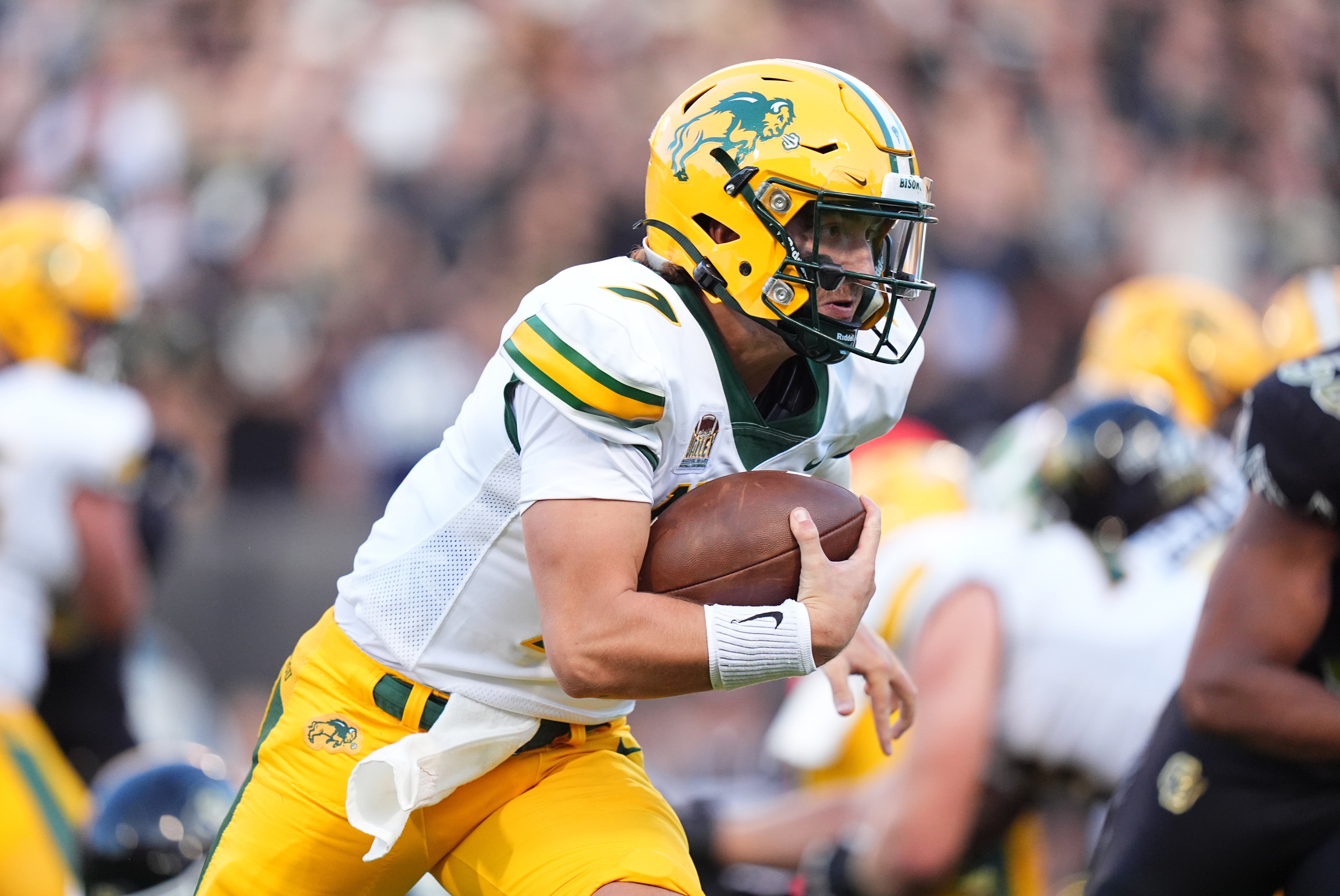 Aug 29, 2024; Boulder, Colorado, USA; North Dakota State Bison quarterback Cam Miller (7) rushes for a touchdown in the second quarter against the Colorado Buffaloes at Folsom Field.