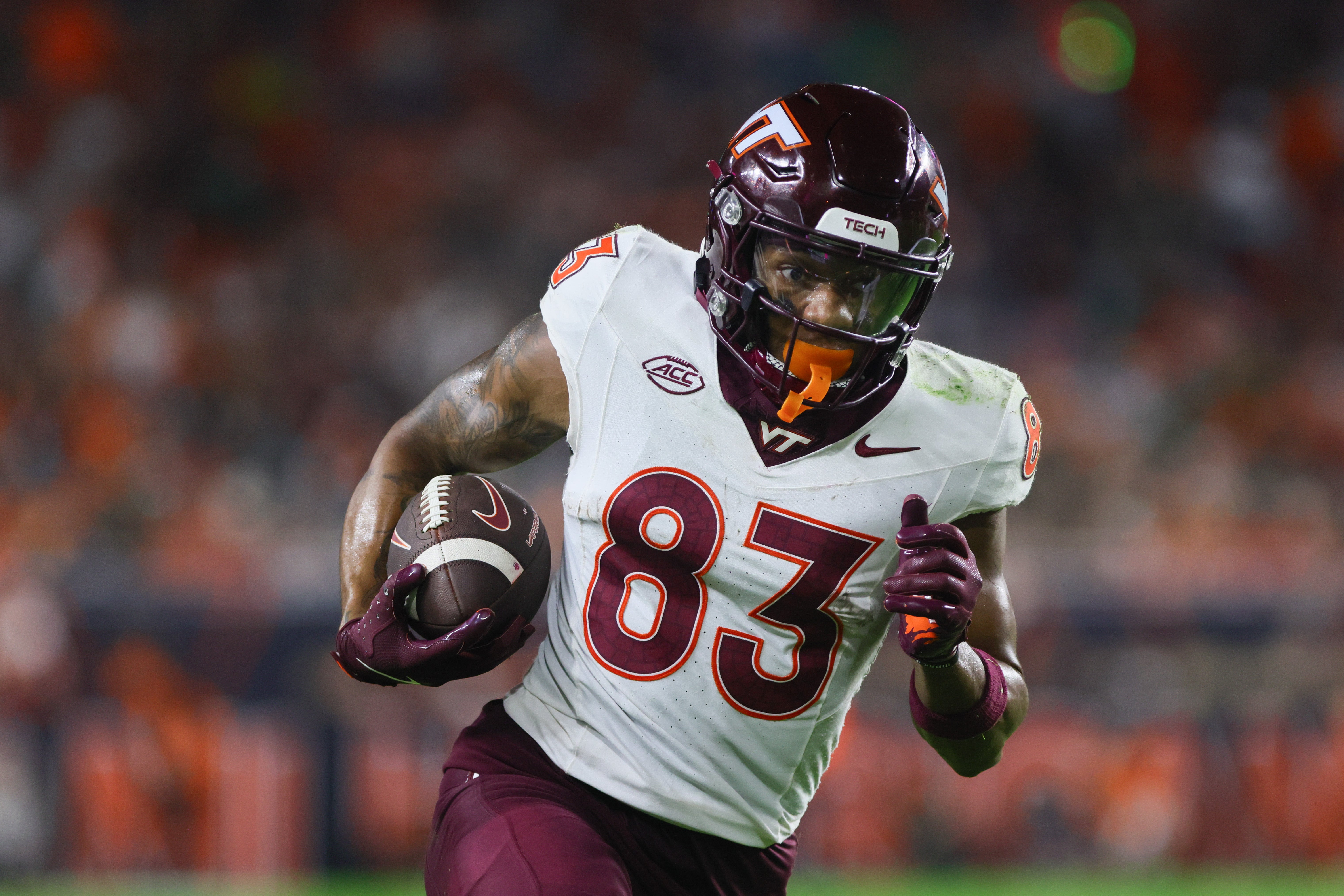 Sep 27, 2024; Miami Gardens, Florida, USA; Virginia Tech Hokies wide receiver Jaylin Lane (83) run with the football for a touchdown against the Miami Hurricanes during the second quarter at Hard Rock Stadium.