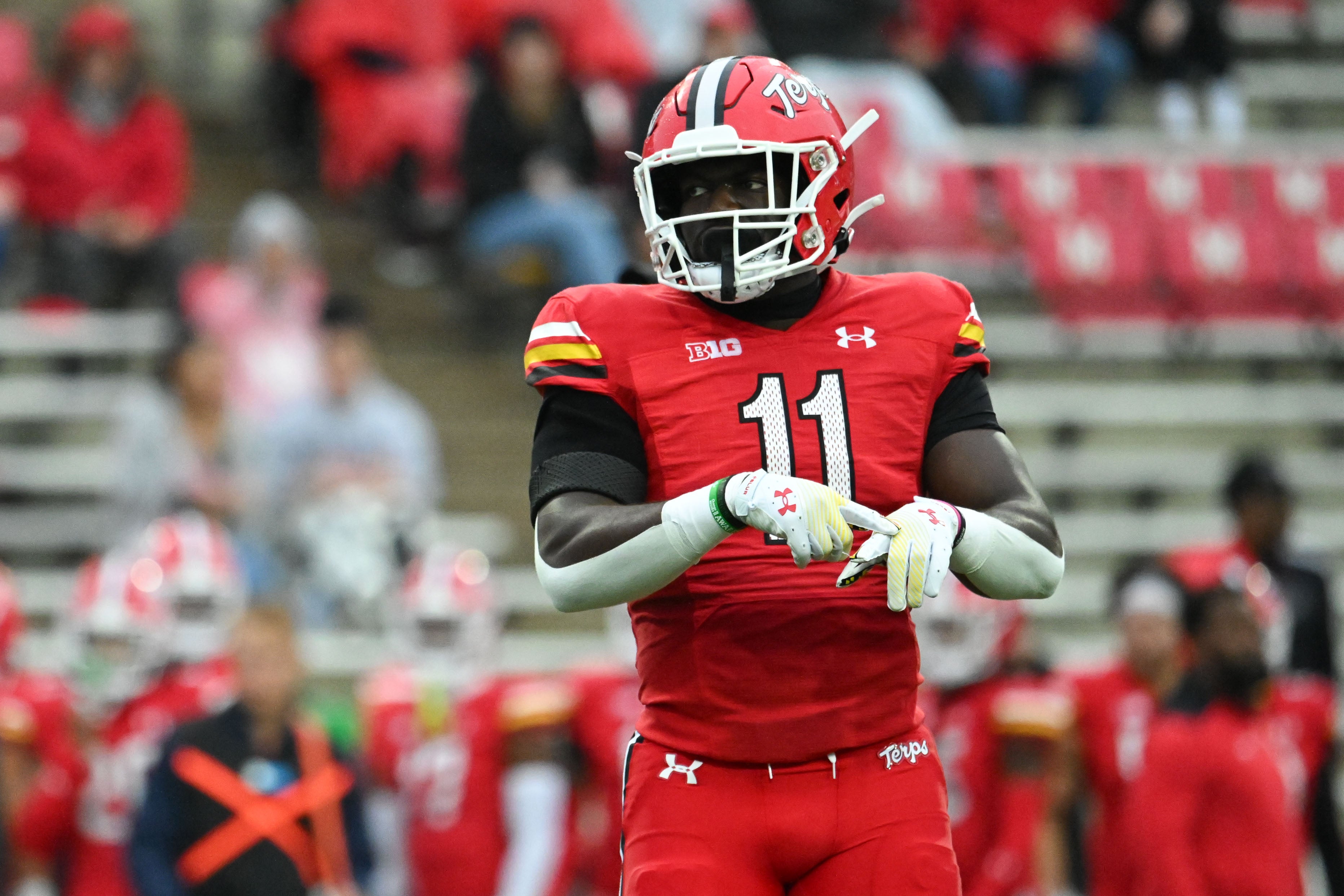 Oct 14, 2023; College Park, Maryland, USA; Maryland Terrapins linebacker Ruben Hyppolite II (11) points to his hand during the first half against the Illinois Fighting Illini at SECU Stadium.