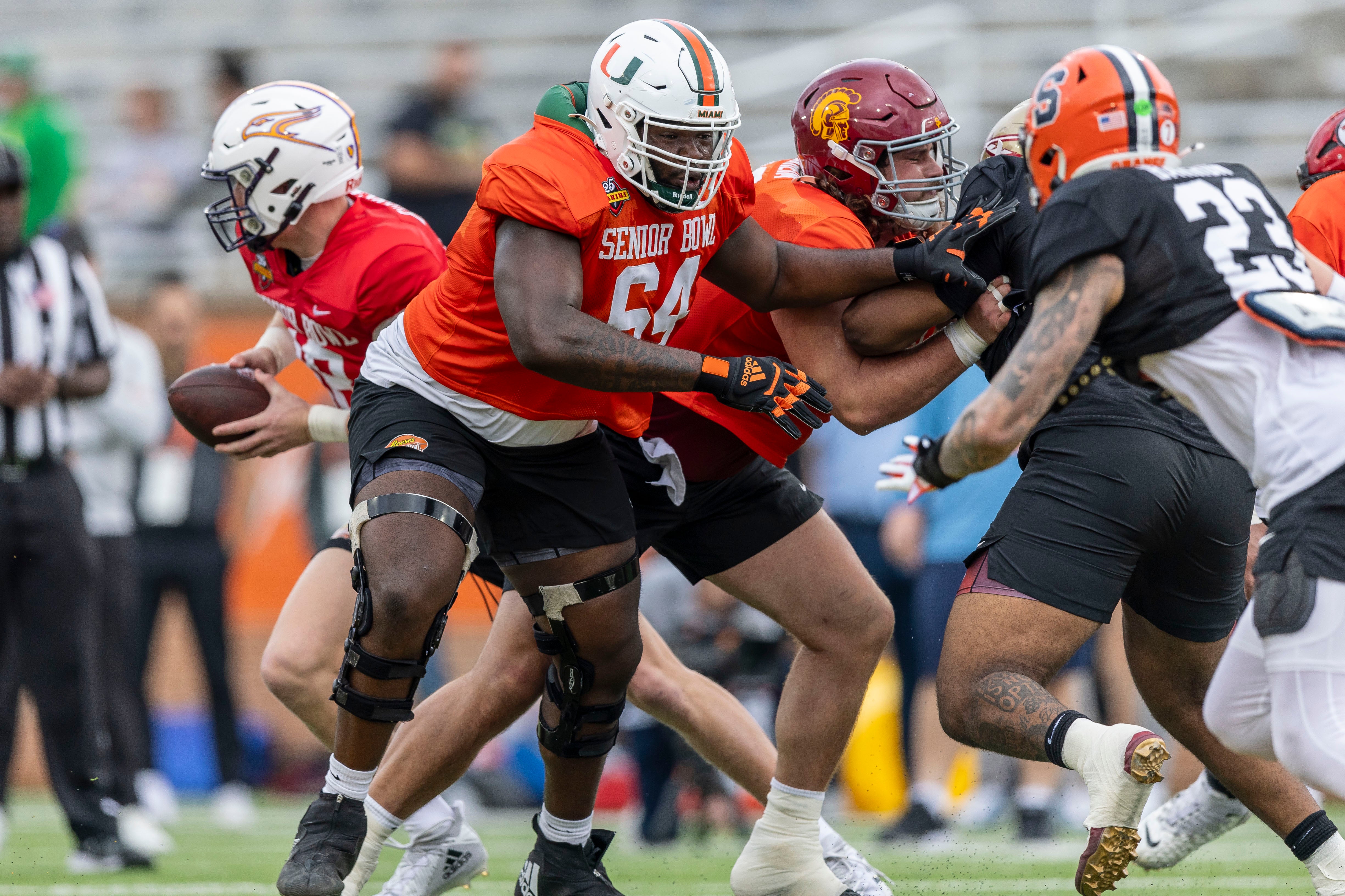 Jan 30, 2025; Mobile, AL, USA; National team offensive lineman Jalen Rivers of Miami (64) works through drills during Senior Bowl practice for the National team at Hancock Whitney Stadium.