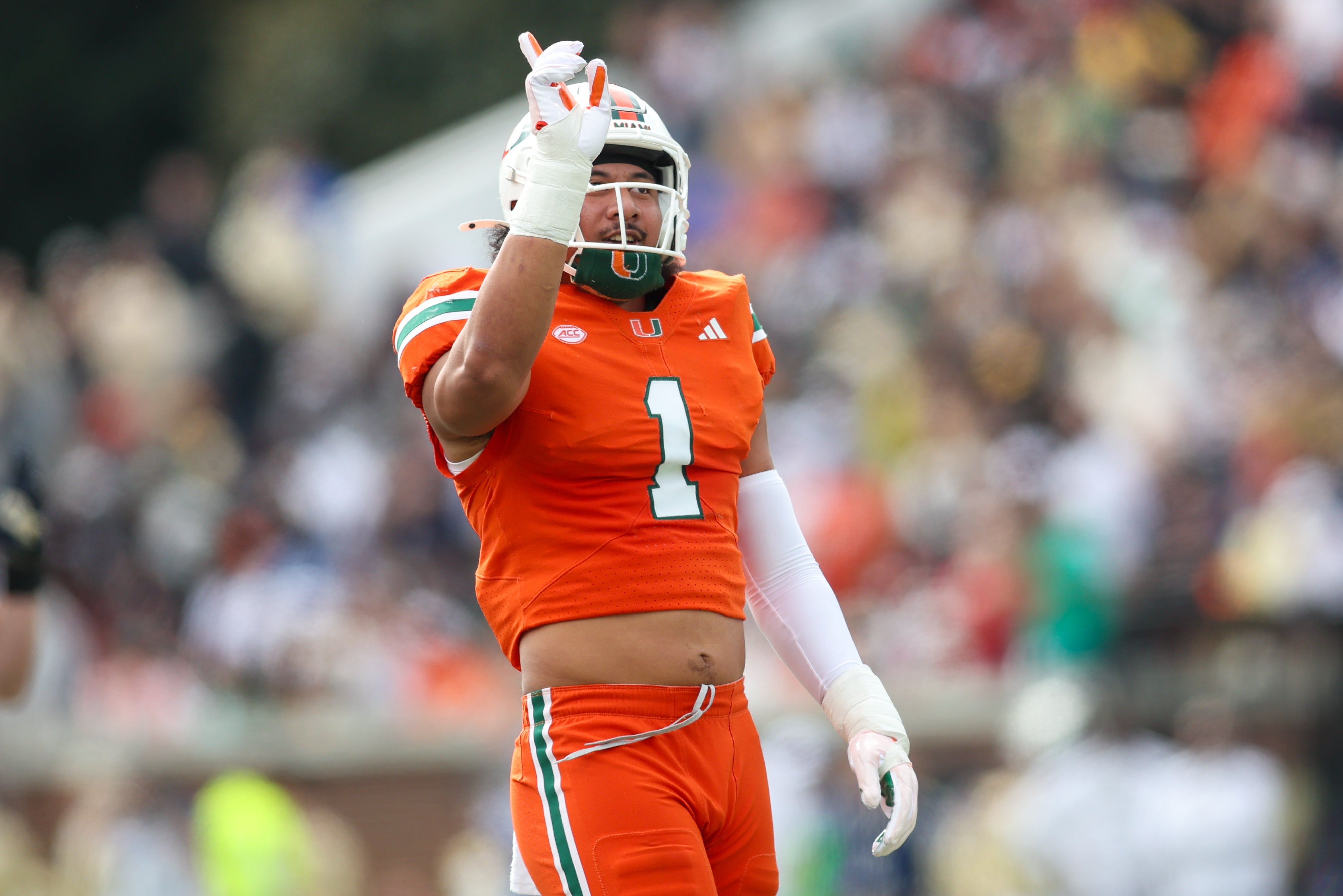 Miami Hurricanes linebacker Francisco Mauigoa (1) reacts after a tackle against the Georgia Tech Yellow Jackets in the first quarter at Bobby Dodd Stadium at Hyundai Field.