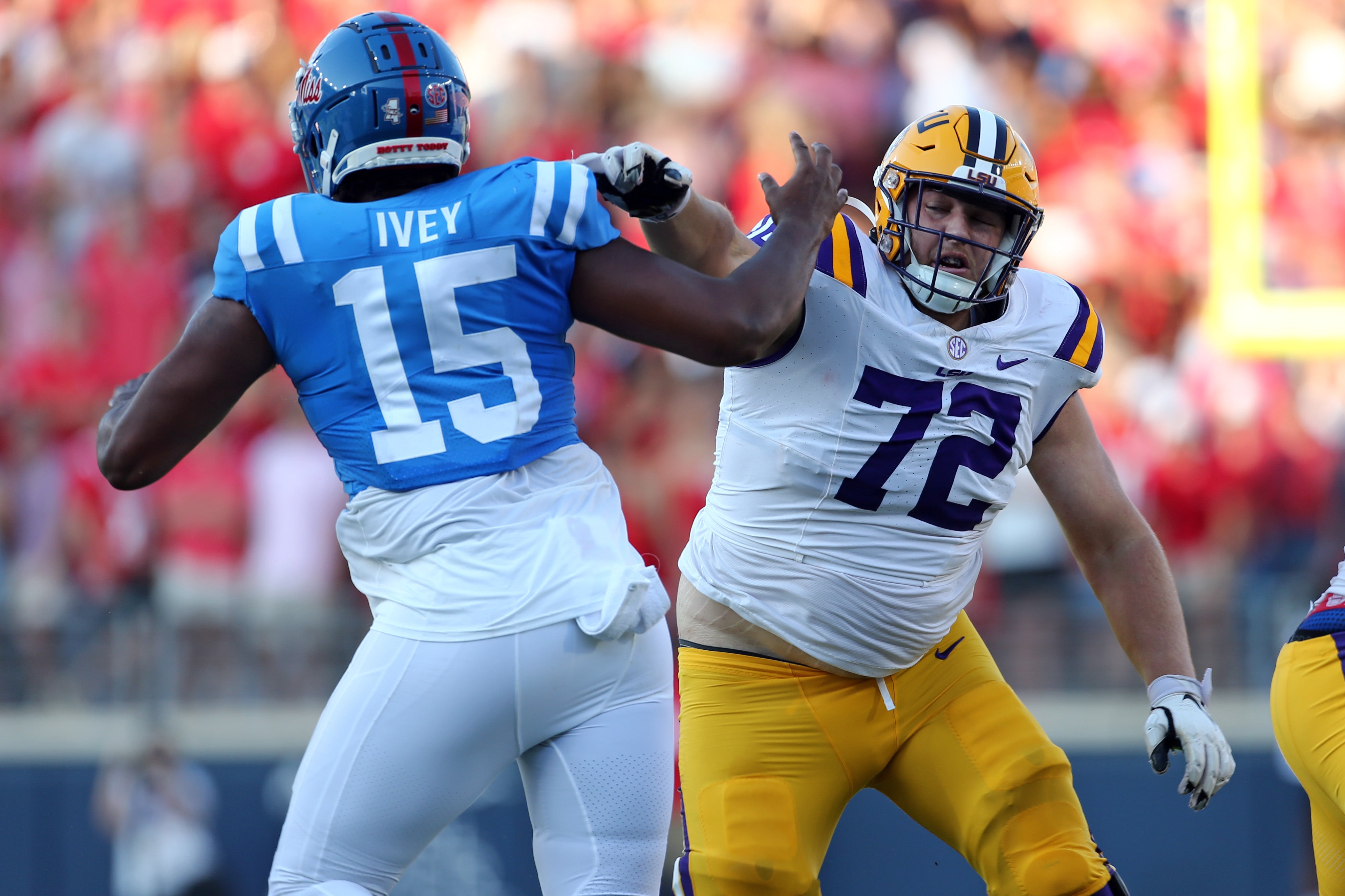 Sep 30, 2023; Oxford, Mississippi, USA; LSU Tigers offensive linemen Garrett Dellinger (72) blocks Mississippi Rebels defensive linemen Jared Ivey (15) during the first half at Vaught-Hemingway Stadium