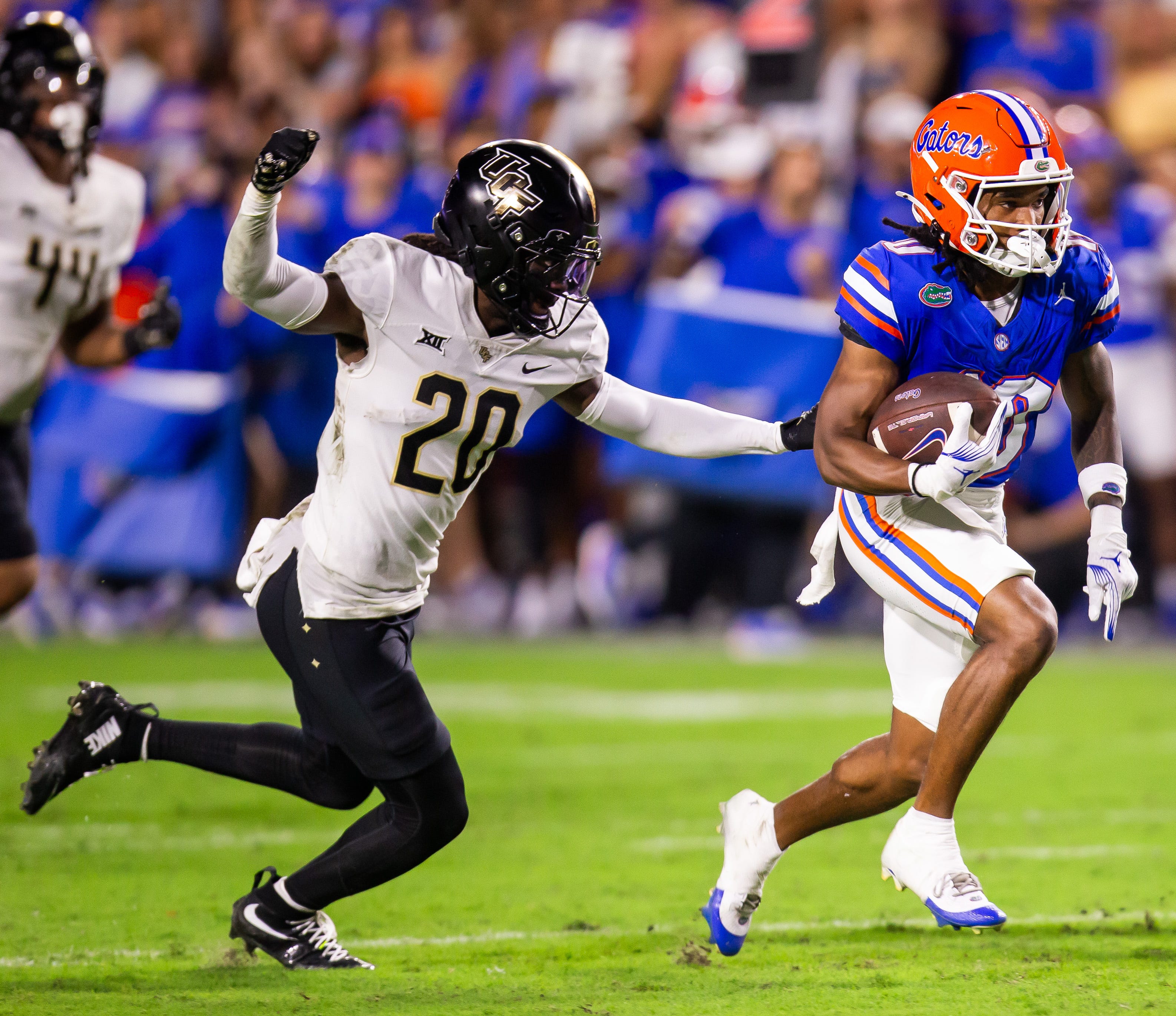 Florida Gators wide receiver Tank Hawkins (10) outruns UCF Knights defensive back Mac McWilliams (20) during the first half at Ben Hill Griffin Stadium in Gainesville, FL on Saturday, October 5, 2024....