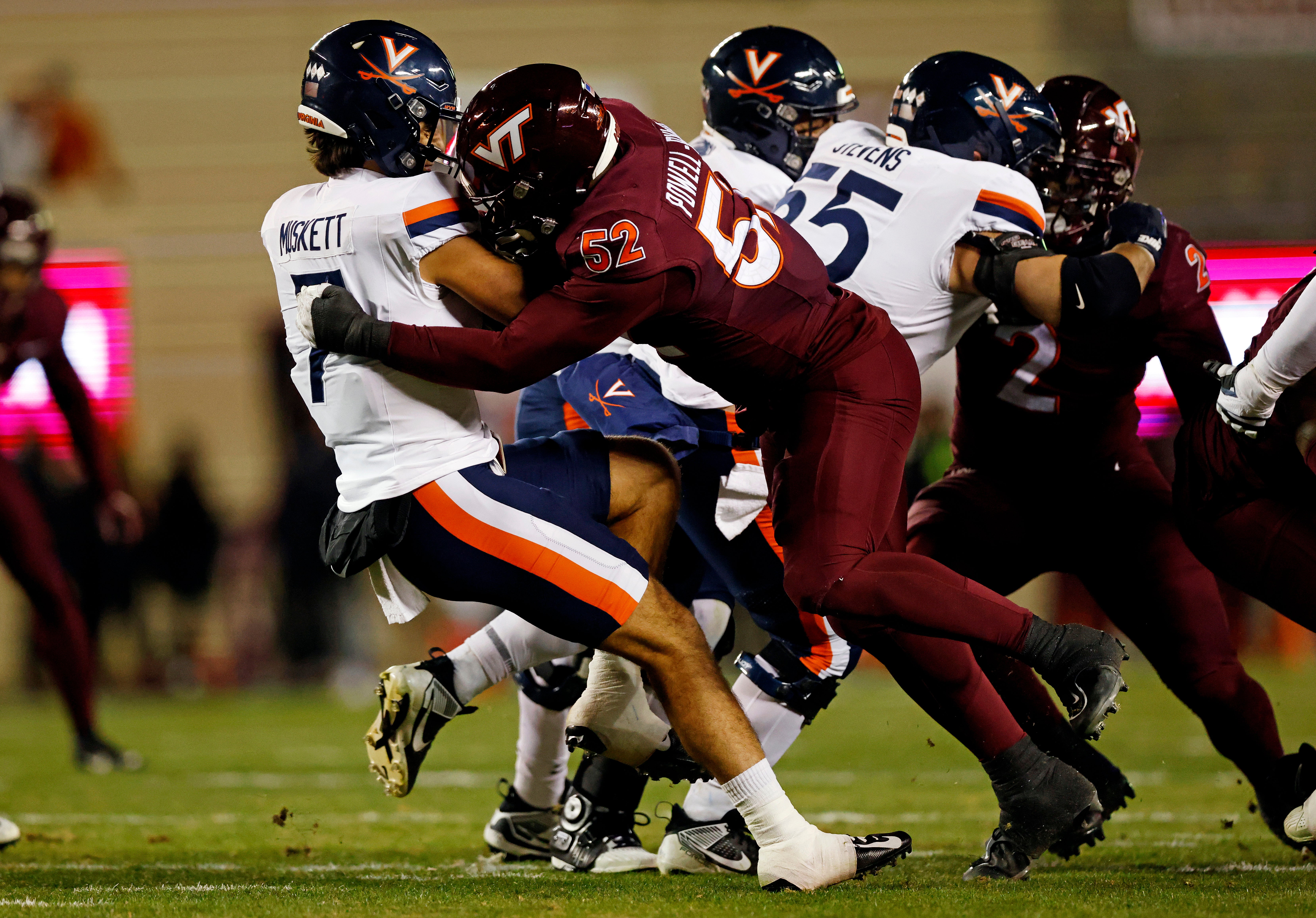 Virginia Tech Hokies defensive lineman Antwaun Powell-Ryland (52) sacks Virginia Cavaliers quarterback Tony Muskett (7) during the first quarter at Lane Stadium.