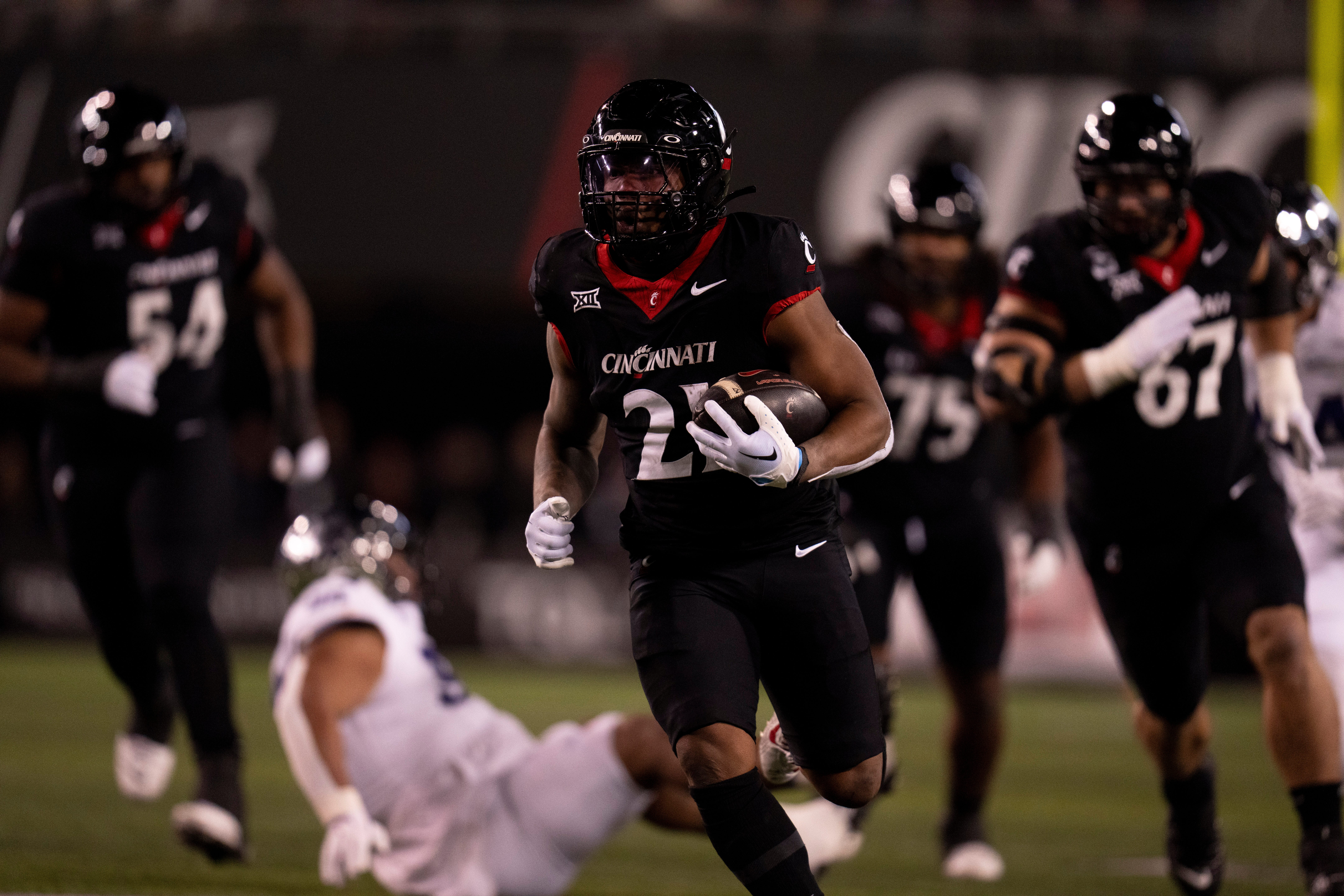 Cincinnati Bearcats running back Corey Kiner (21) runs to the 1-yard line in the second quarter of the NCAA football game between Cincinnati Bearcats and TCU Horned Frogs at Nippert Stadium in Cincinnati on Saturday, Nov. 30, 2024.