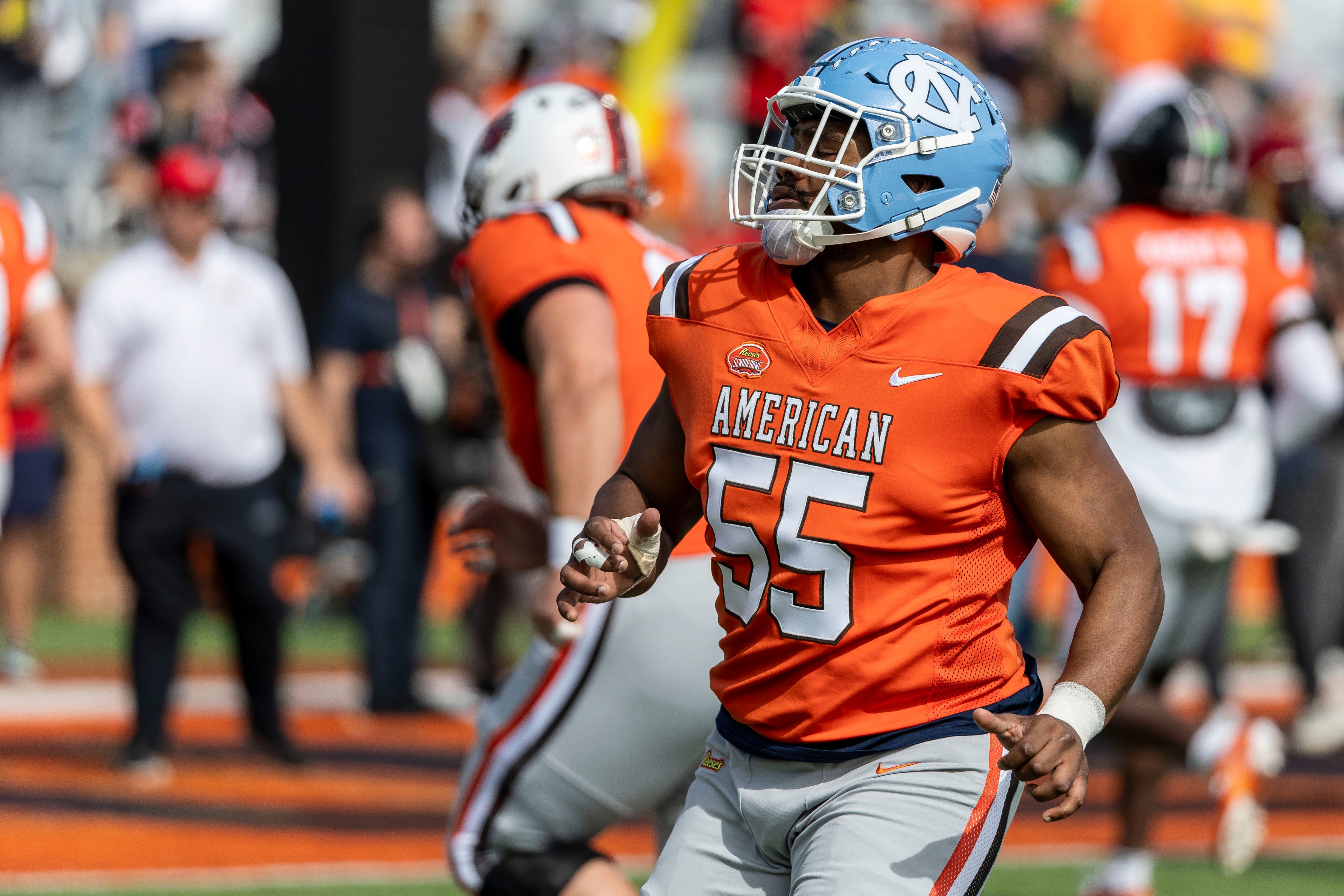 Feb 1, 2025; Mobile, AL, USA; American team offensive lineman Willie Lampkin of North Carolina (55) warms up before the 2025 Senior Bowl football game at Hancock Whitney Stadium.