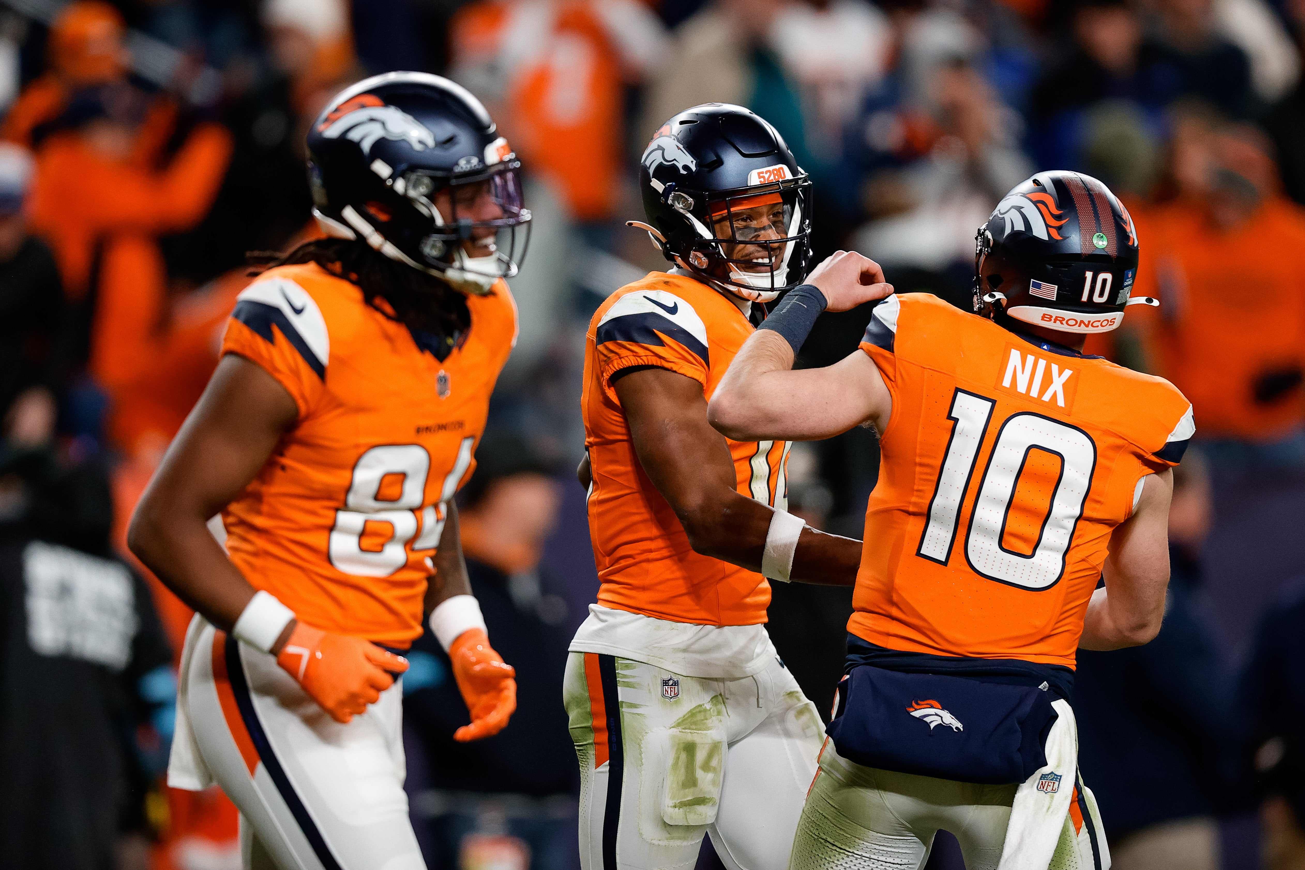 Denver Broncos wide receiver Courtland Sutton (14) celebrates with quarterback Bo Nix (10) after a touchdown ahead of wide receiver Lil'Jordan Humphrey (84) in the fourth quarter against the Indianapolis Colts