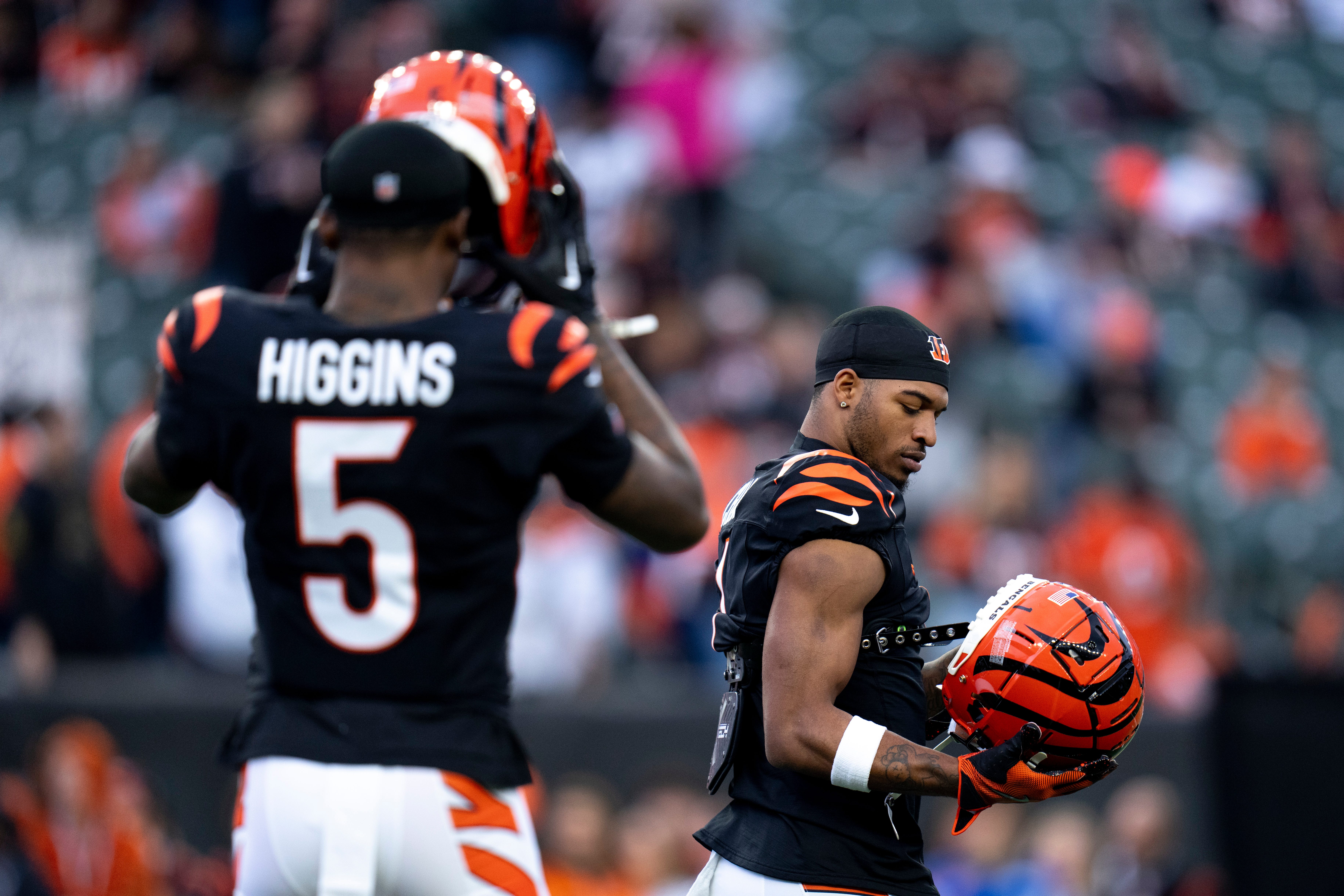 Cincinnati Bengals wide receiver Ja'Marr Chase (1) and Cincinnati Bengals wide receiver Tee Higgins (5) prepare to warm up before the NFL game between the Cincinnati Bengals and the Denver Broncos at Paycor Stadium in Cincinnati on Saturday, Dec. 28, 2024.  
