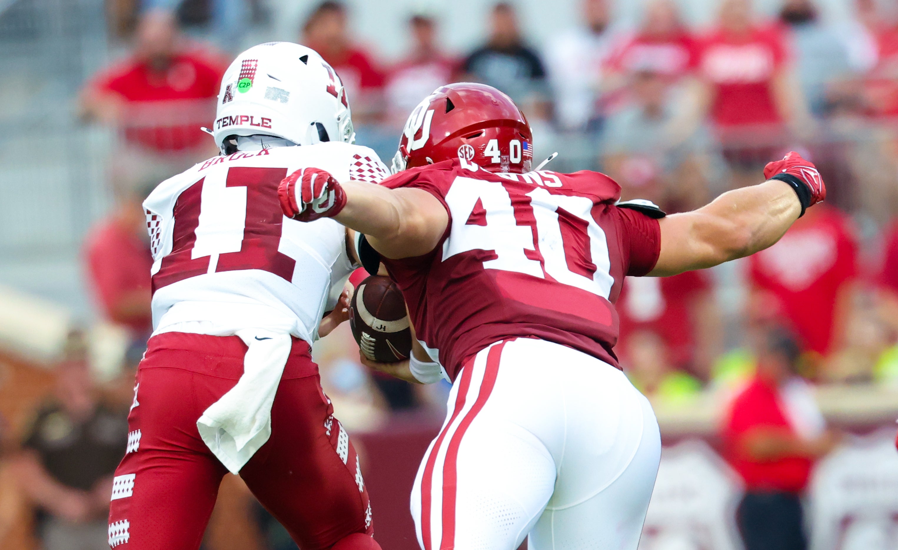 Aug 30, 2024; Norman, Oklahoma, USA; Oklahoma Sooners defensive lineman Ethan Downs (40) causes Temple Owls quarterback Forrest Brock (11) to fumble during the first quarter at Gaylord Family-Oklahoma Memorial Stadium.