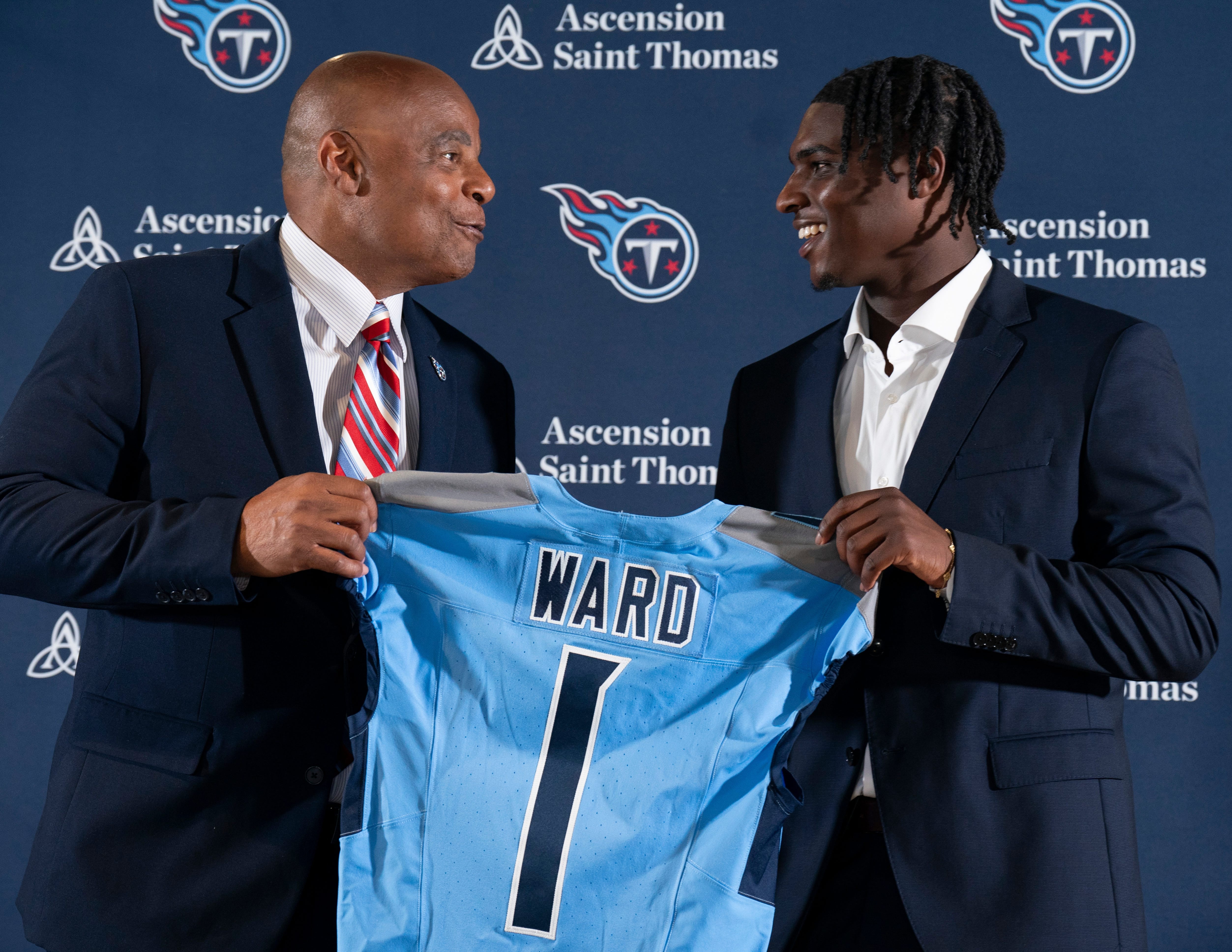 NFL Hall of Fame quarterback Warren Moon, left, poses for pictures with Cam Ward who earlier had been introduced as the Tennessee Titans first-round in the NFL Draft at Ascension Saint Thomas Sports Park in Nashville, Tenn., Friday, April 25, 2025.