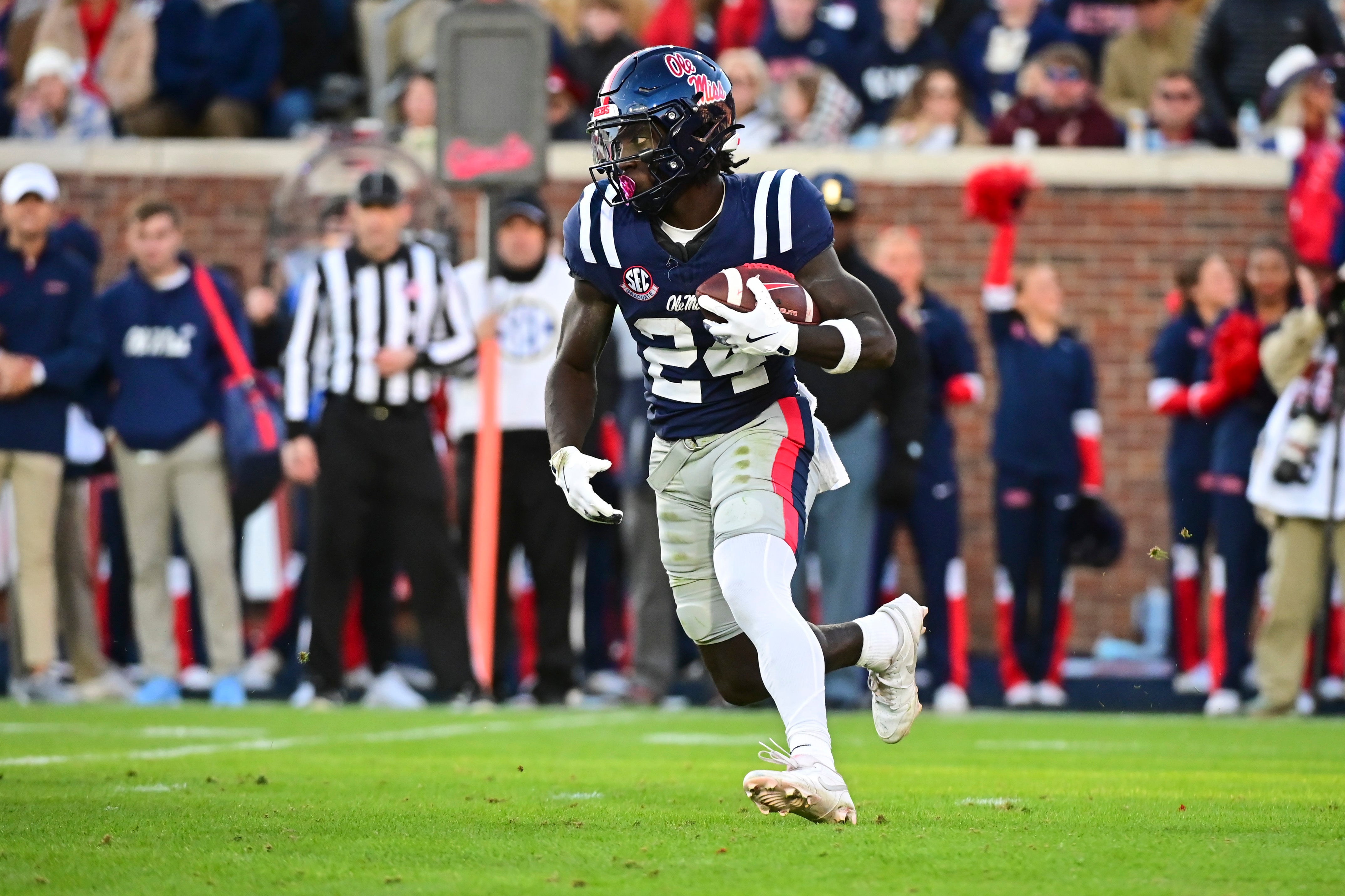 Nov 29, 2024; Oxford, Mississippi, USA; Mississippi Rebels running back Ulysses Bentley IV (24) runs the ball against the Mississippi State Bulldogs during a play that would result in a touchdown during the second quarter at Vaught-Hemingway Stadium.