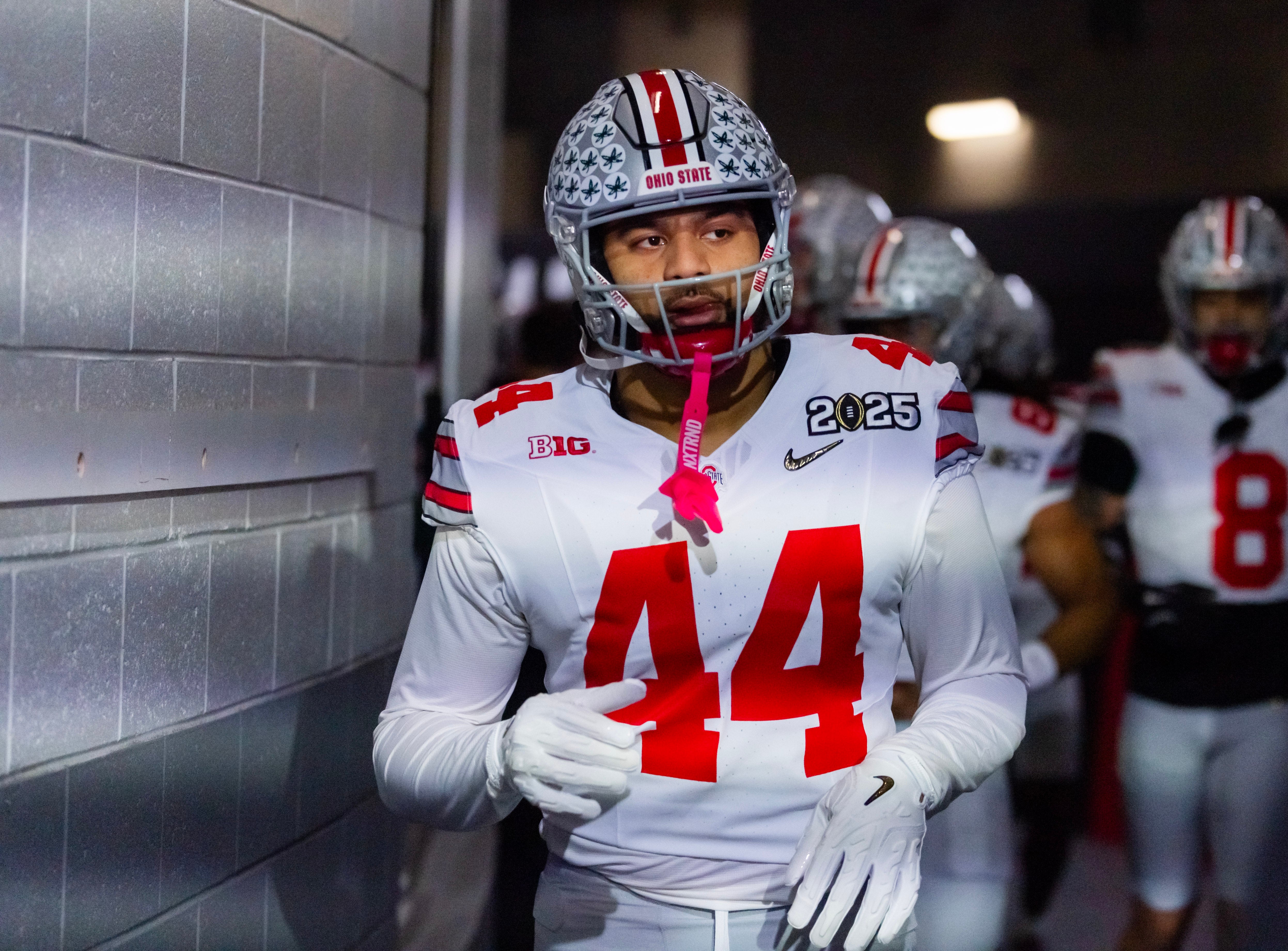 Jan 20, 2025; Atlanta, GA, USA; Ohio State Buckeyes defensive end JT Tuimoloau (44) against the Notre Dame Fighting Irish during the CFP National Championship college football game at Mercedes-Benz Stadium.