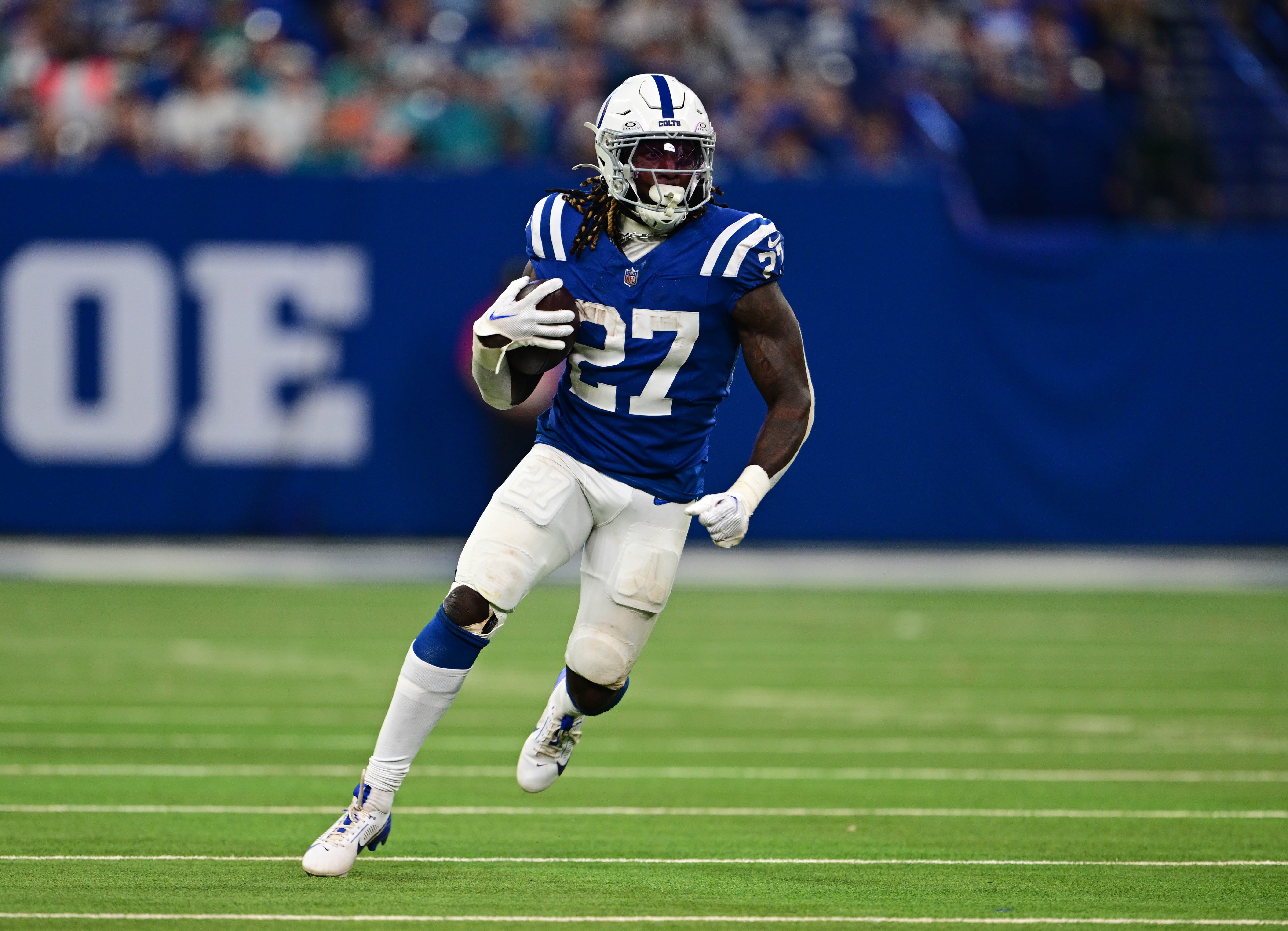 Oct 20, 2024; Indianapolis, Indiana, USA; Indianapolis Colts running back Trey Sermon (27) runs the ball during the second half against the Miami Dolphins at Lucas Oil Stadium.