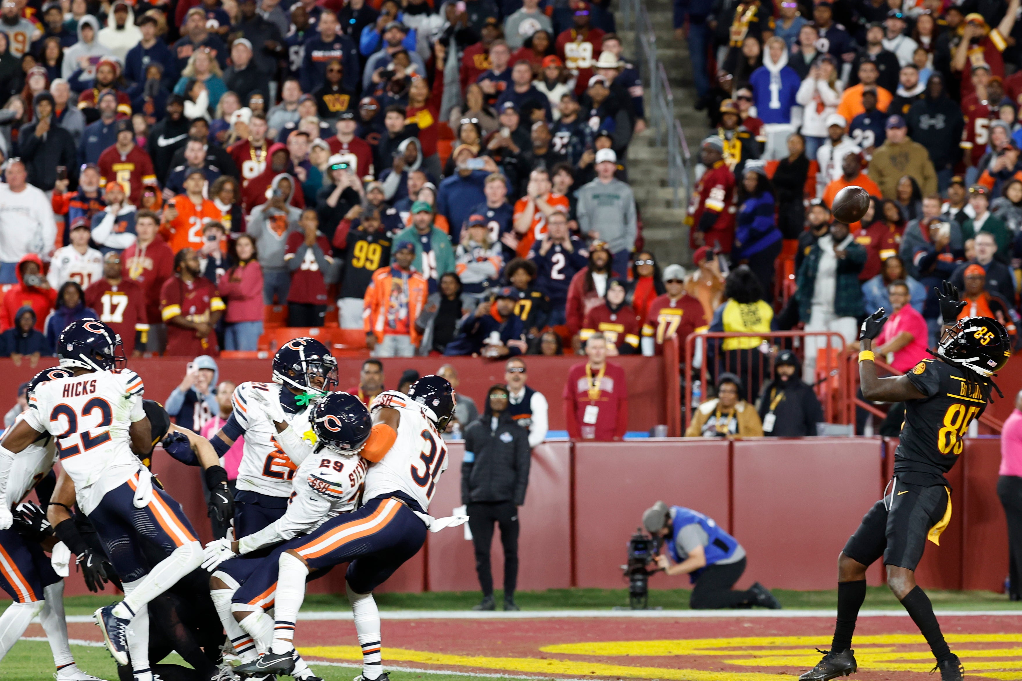 Oct 27, 2024; Landover, Maryland, USA; Washington Commanders wide receiver Noah Brown (85) prepares to catch a game-winnning Hail Mary pass on the final play of the game against the Chicago Bears at Northwest Stadium.