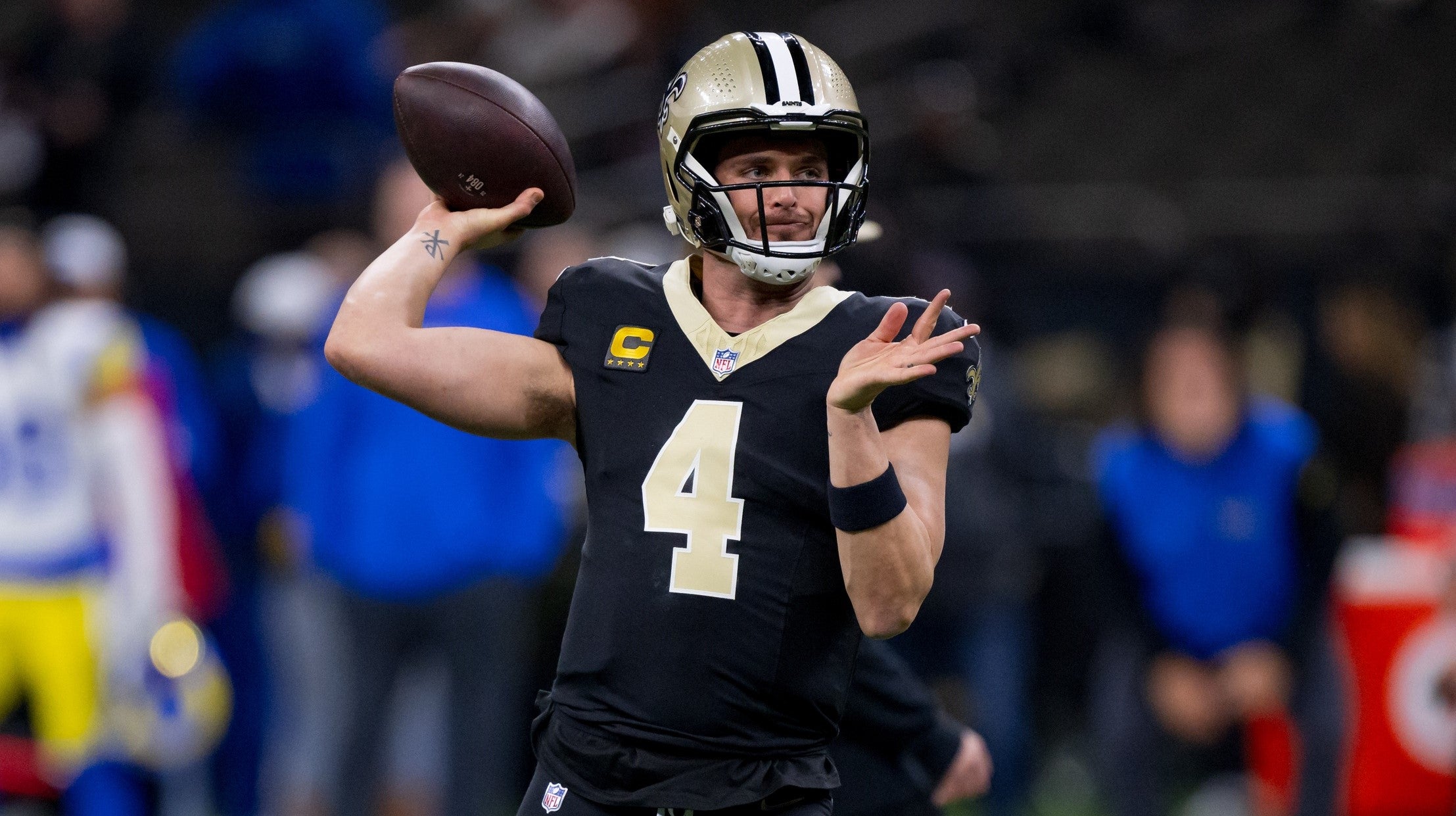 Dec 1, 2024; New Orleans, Louisiana, USA; New Orleans Saints quarterback Derek Carr (4) throws before a game against the Los Angeles Rams at Caesars Superdome.