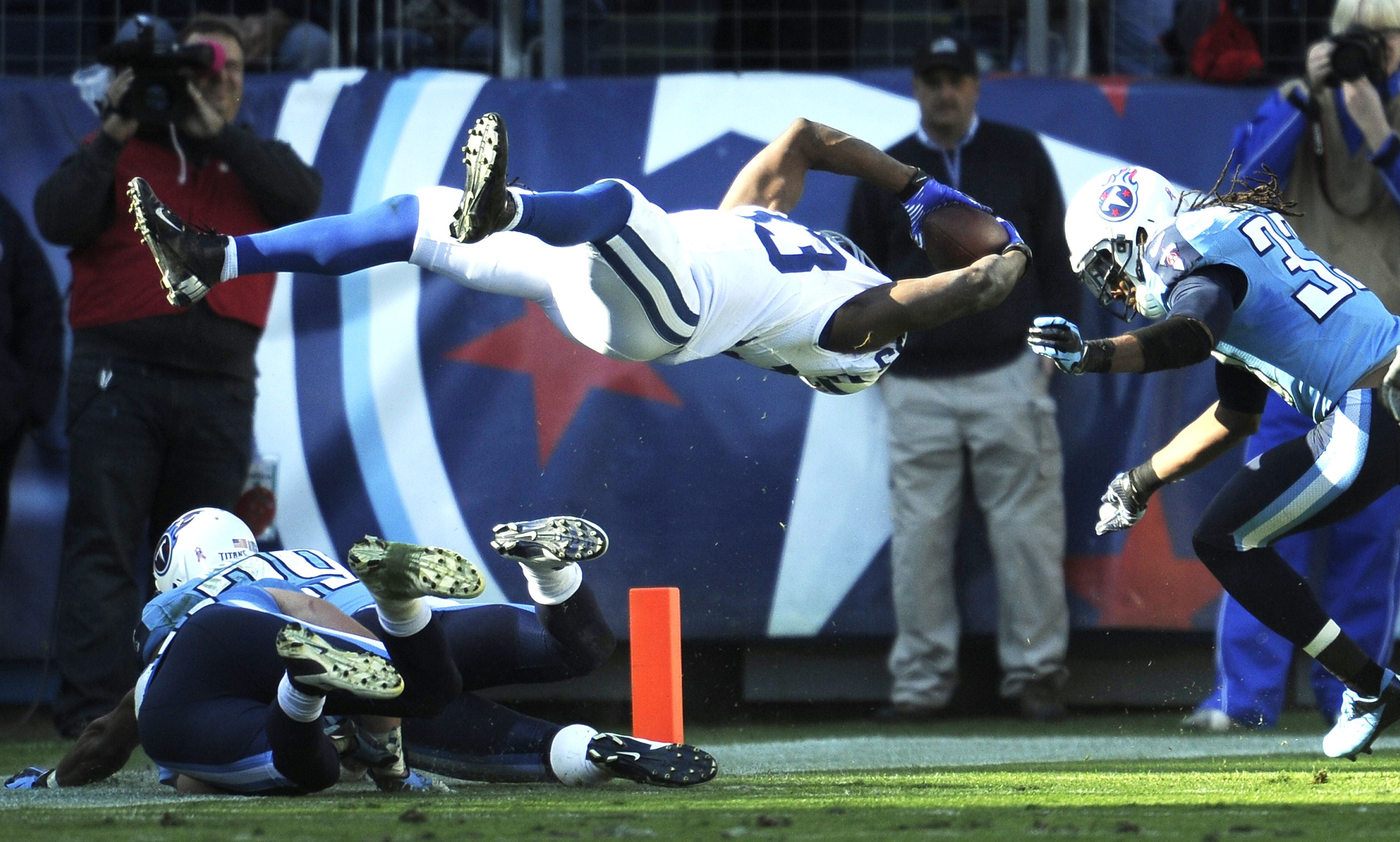 Colts running back Vick Ballard (33) dives into the end zone to past Titans free safety Michael Griffin (33) to score the game winning touchdown in overtime as the Colts win 19 to 13 at LP Field Sunday, Oct. 28, 2012 in Nashville, Tenn. 2012 Luck06  