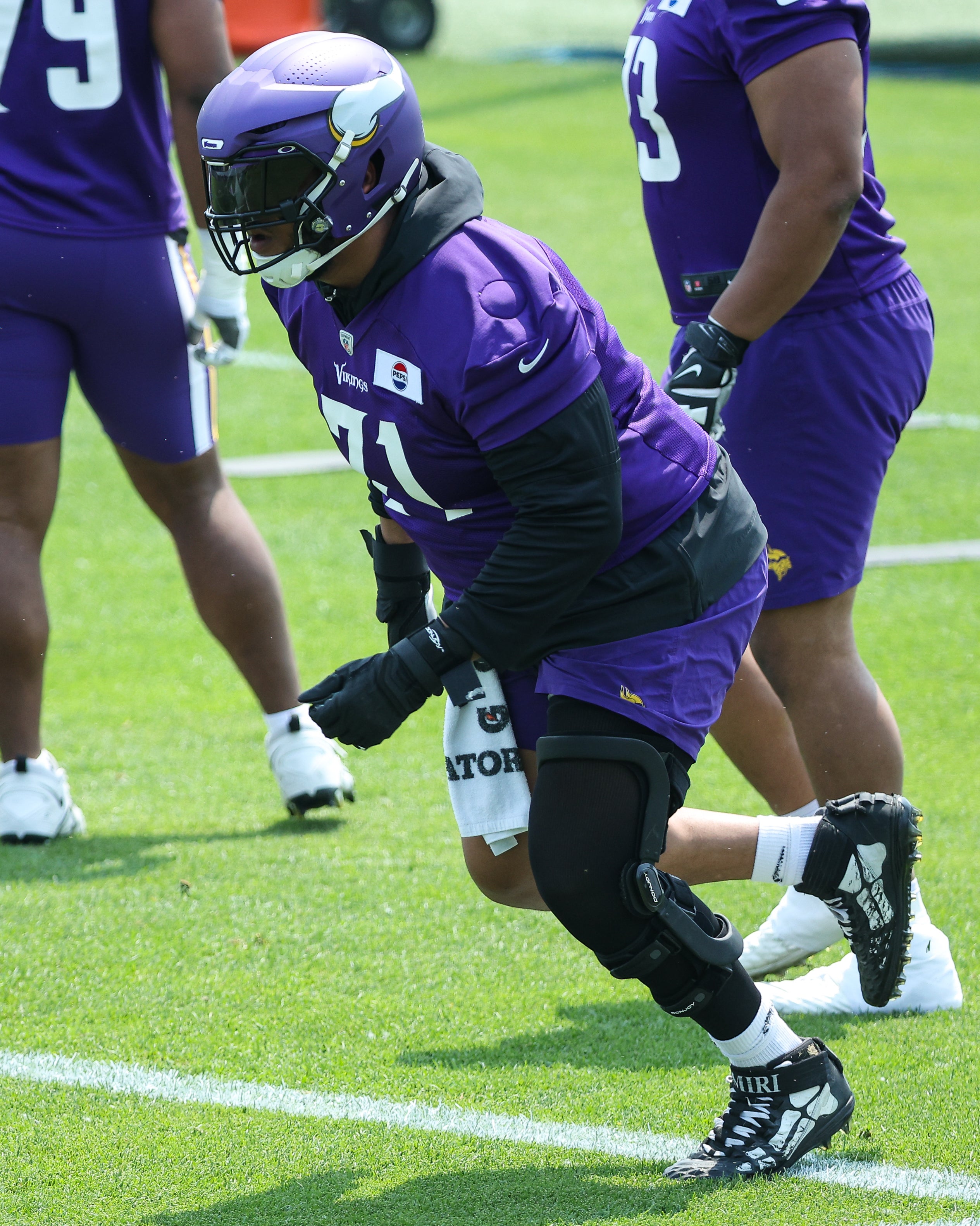 Jun 10, 2025; Minneapolis, MN, USA; Minnesota Vikings offensive tackle Christian Darrisaw (71) practices during minicamp at the Minnesota Vikings Training Facility.