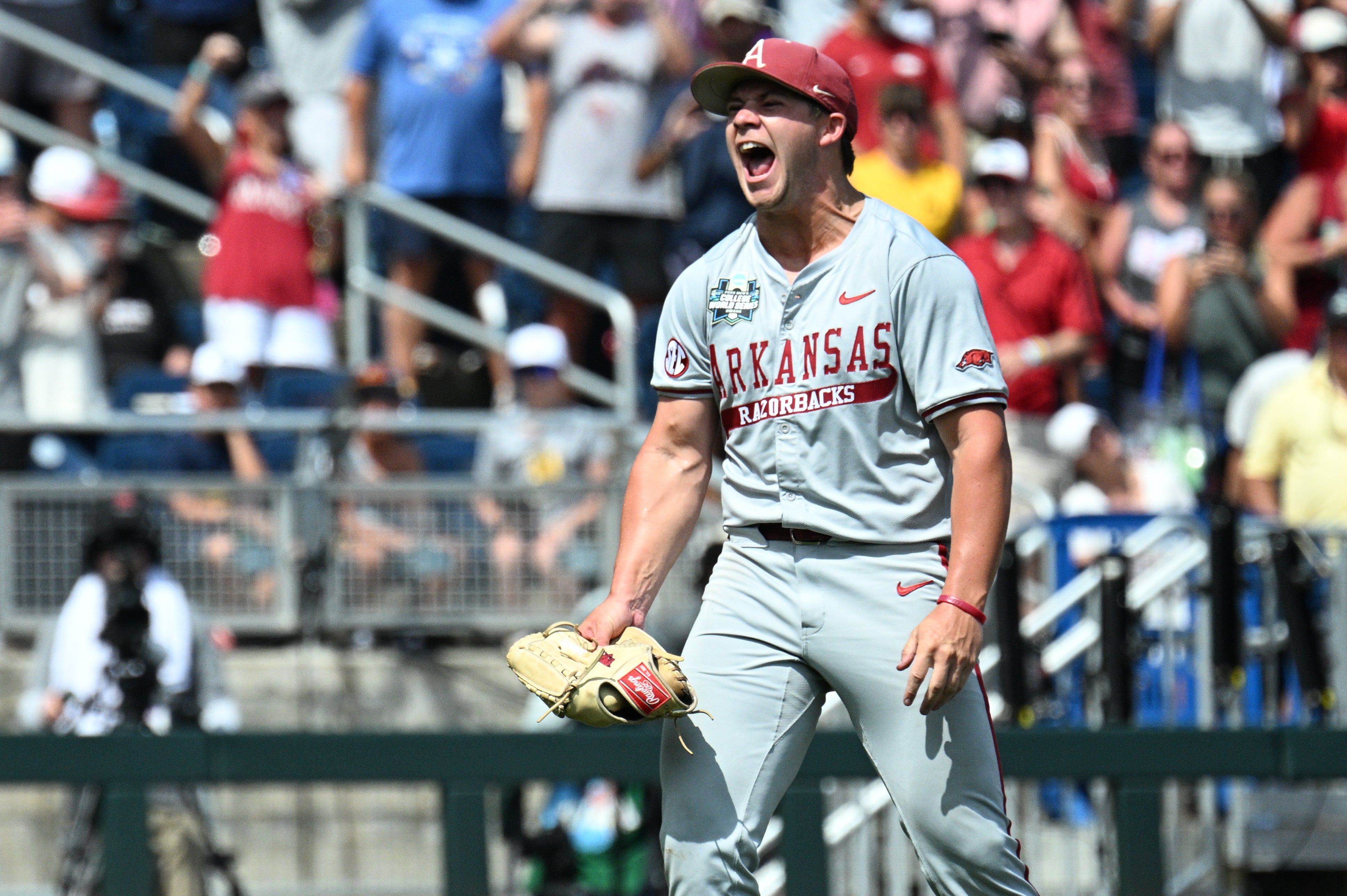 Jun 16, 2025; Omaha, Neb, USA; Arkansas Razorbacks starting pitcher Gage Wood (14) celebrates completing a no hitter against the Murray State Racers at Charles Schwab Field.