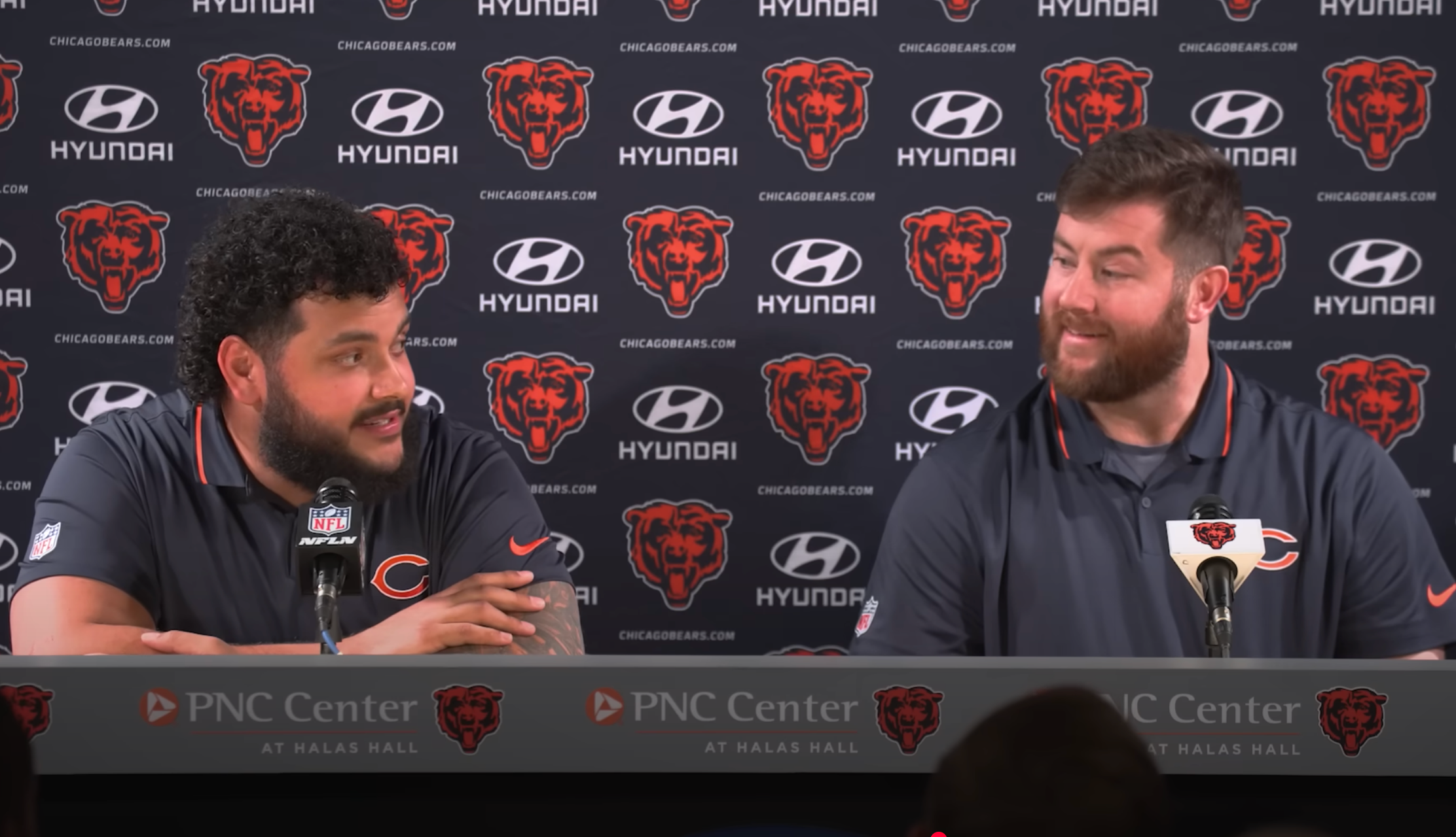 Jonah Jackson (L) and Joe Thuney (R) react together while speaking with reporters at Halas Hall.