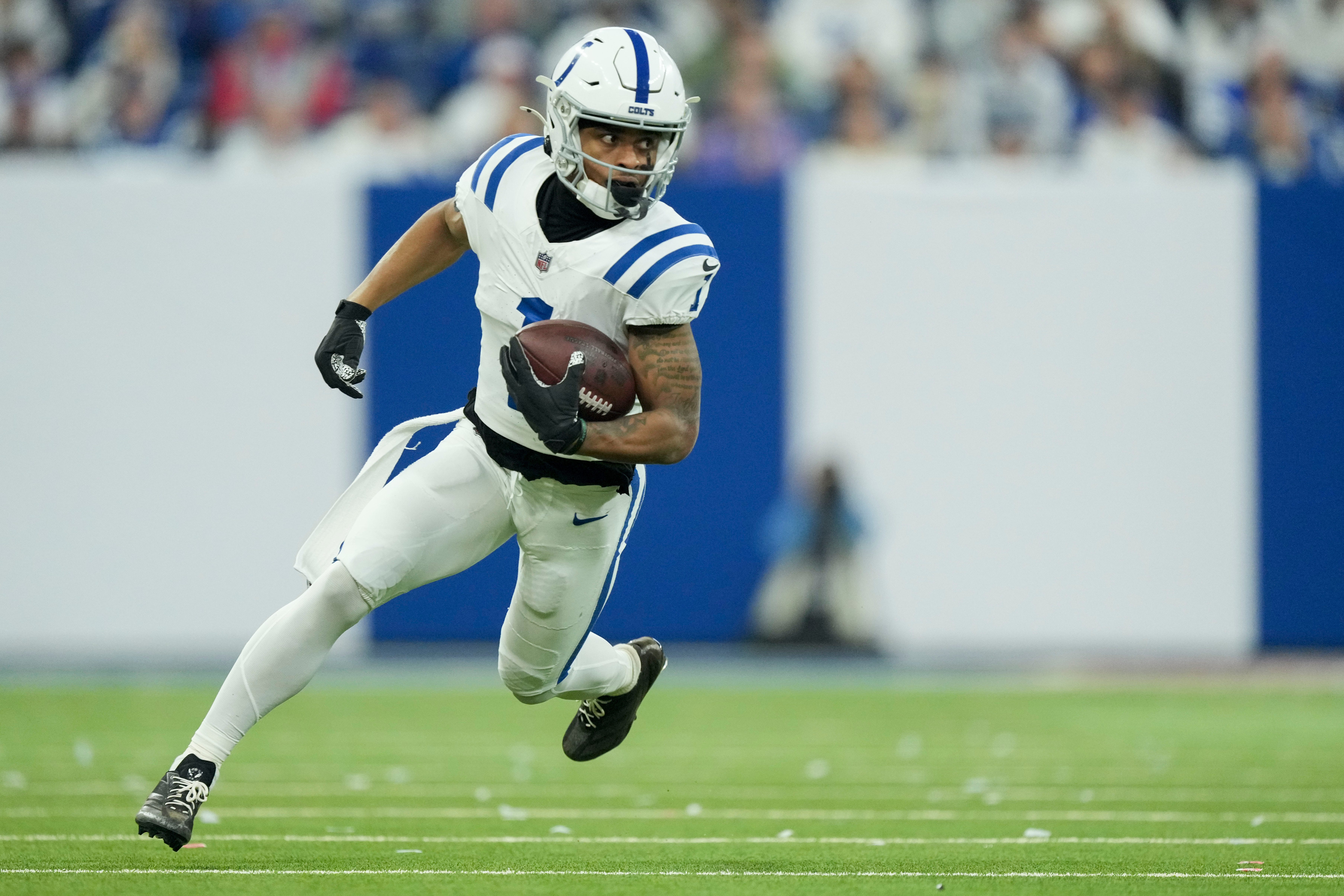 Indianapolis Colts wide receiver Josh Downs (1) rushes the ball Sunday, Dec. 22, 2024, during a game against the Tennessee Titans at Lucas Oil Stadium in Indianapolis.