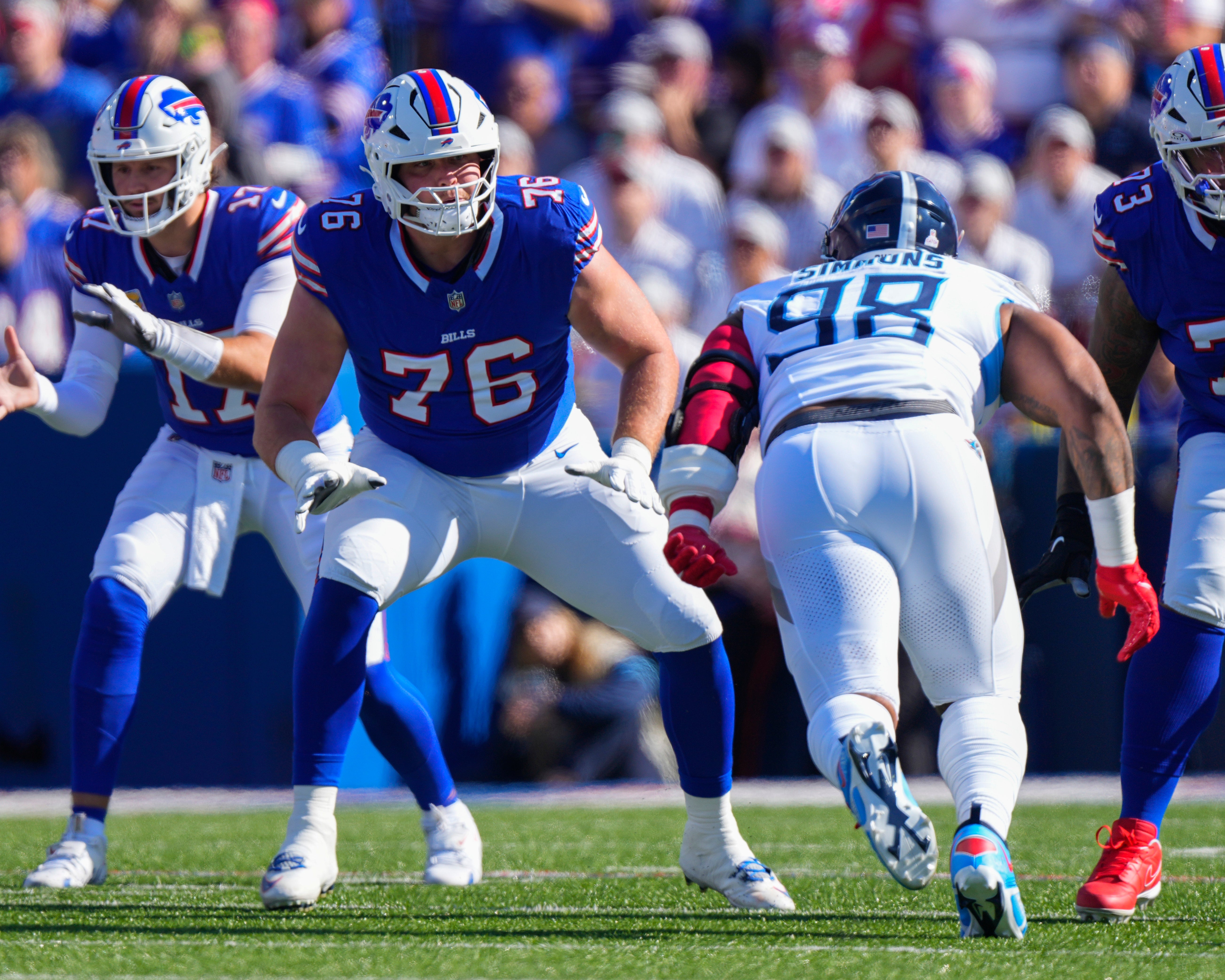 Oct 20, 2024; Orchard Park, New York, USA; Buffalo Bills guard David Edwards (76) looks to block Tennessee Titans defensive tackle Jeffrey Simmons (98) during the first half at Highmark Stadium.