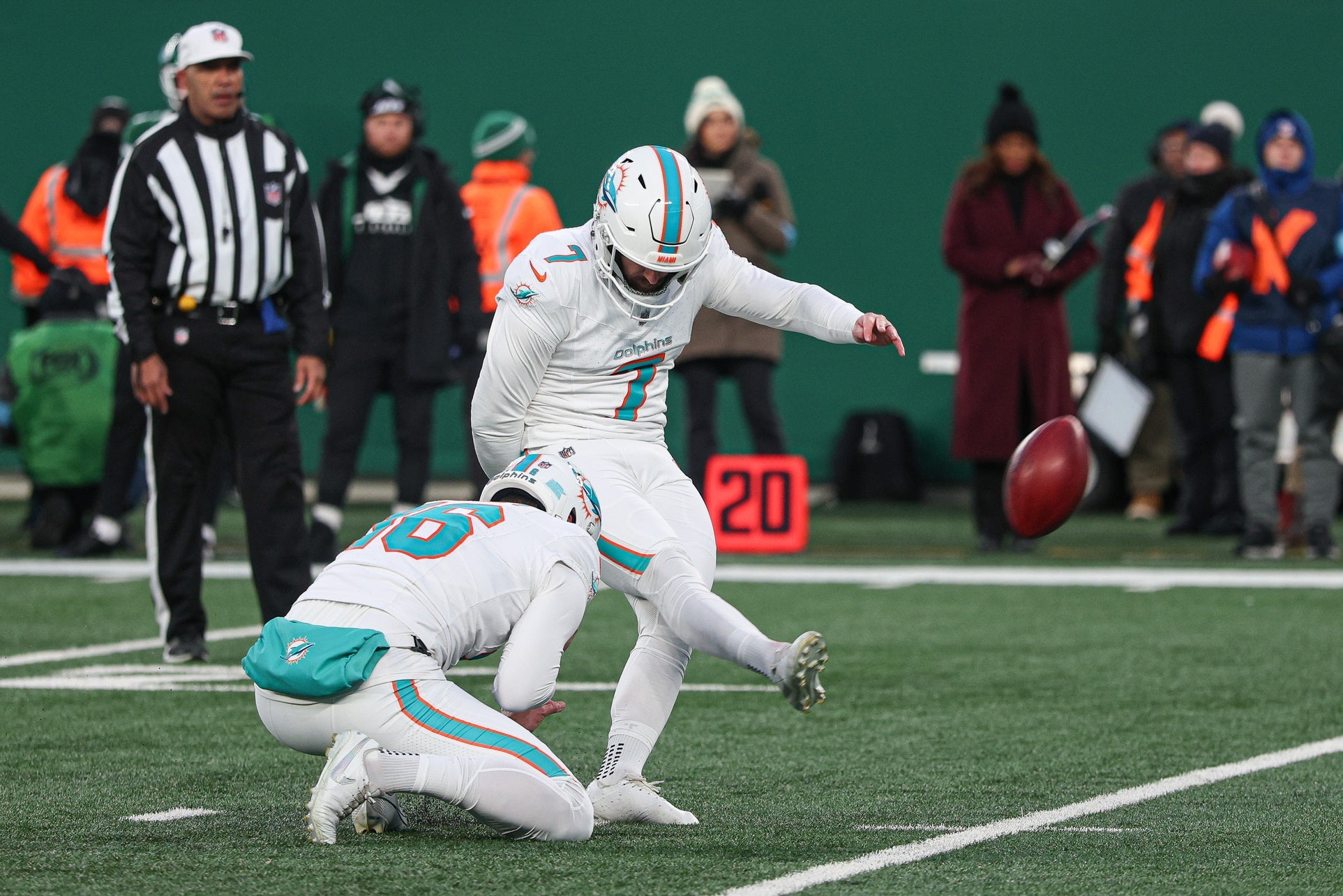 Miami Dolphins place kicker Jason Sanders (7) kicks a field goal as punter Jake Bailey (16) holds during the first quarter against the New York Jets at MetLife Stadium.