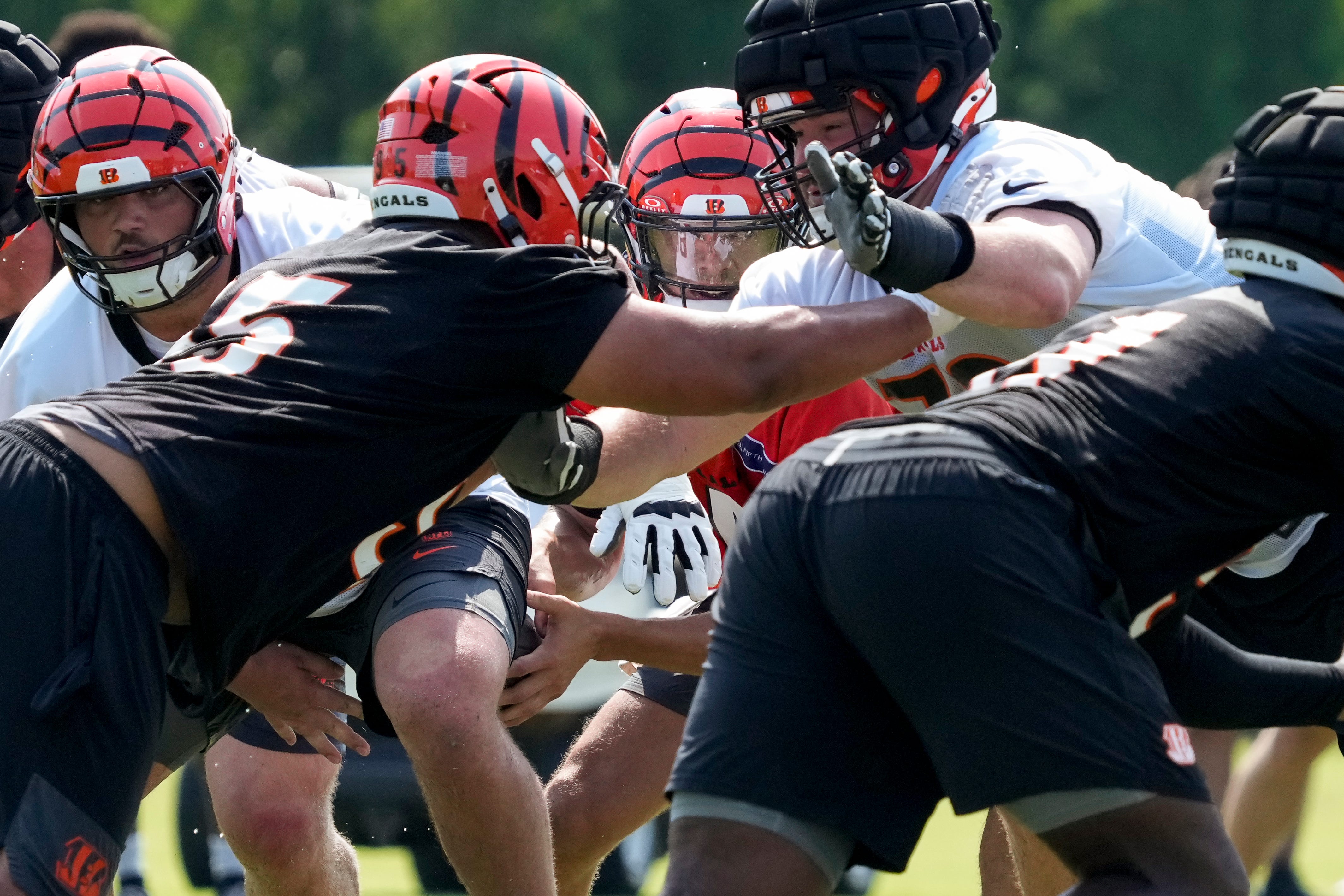 Cincinnati Bengals quarterback Desmond Ridder (4) takes a snap during the second day of preseason training camp in downtown Cincinnati on Thursday, July 24, 2025.