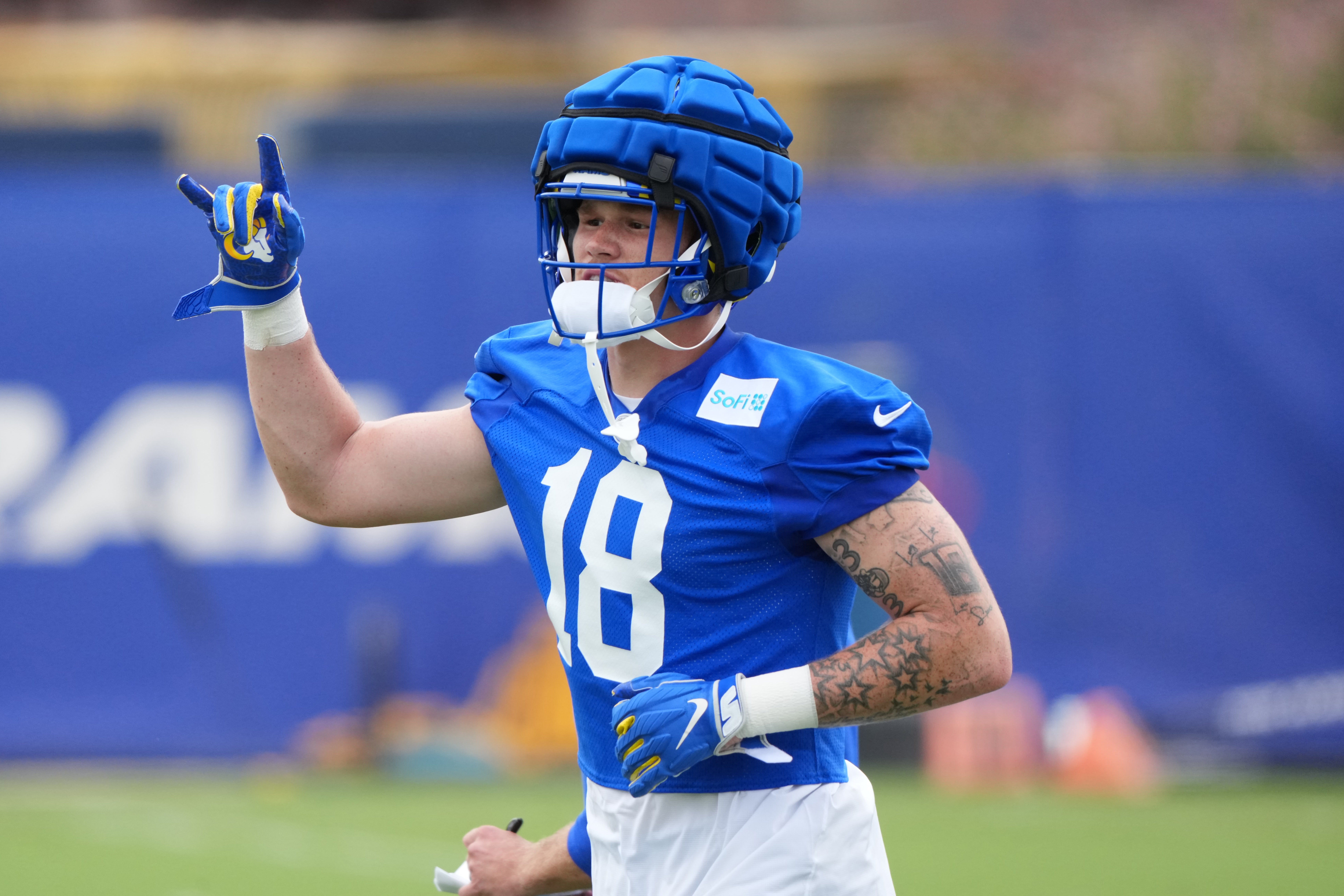May 28, 2025; Woodland Hills, CA, USA; Los Angeles Rams tight end Terrance Ferguson gives a sign during organized team activities at Rams Practice Facility.