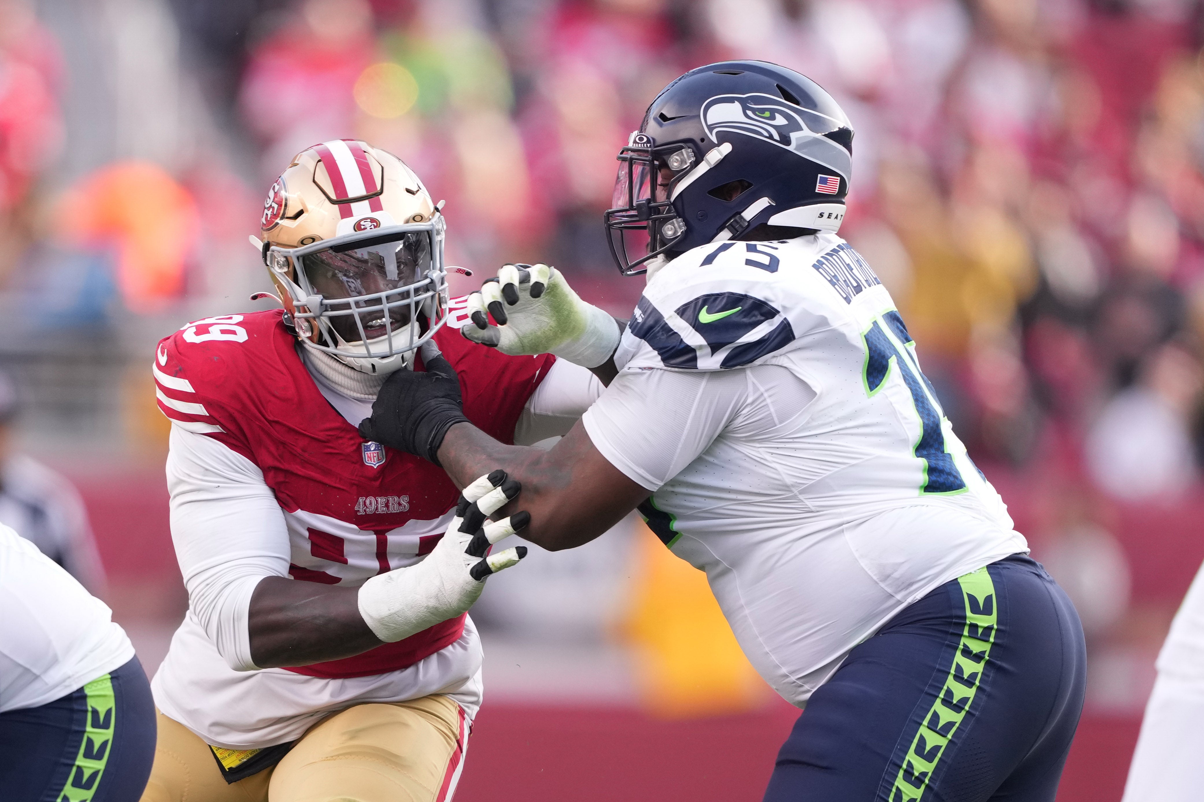 Dec 10, 2023; Santa Clara, California, USA; Seattle Seahawks guard Anthony Bradford (75) blocks San Francisco 49ers defensive tackle Javon Kinlaw (left) during the third quarter at Levi's Stadium.