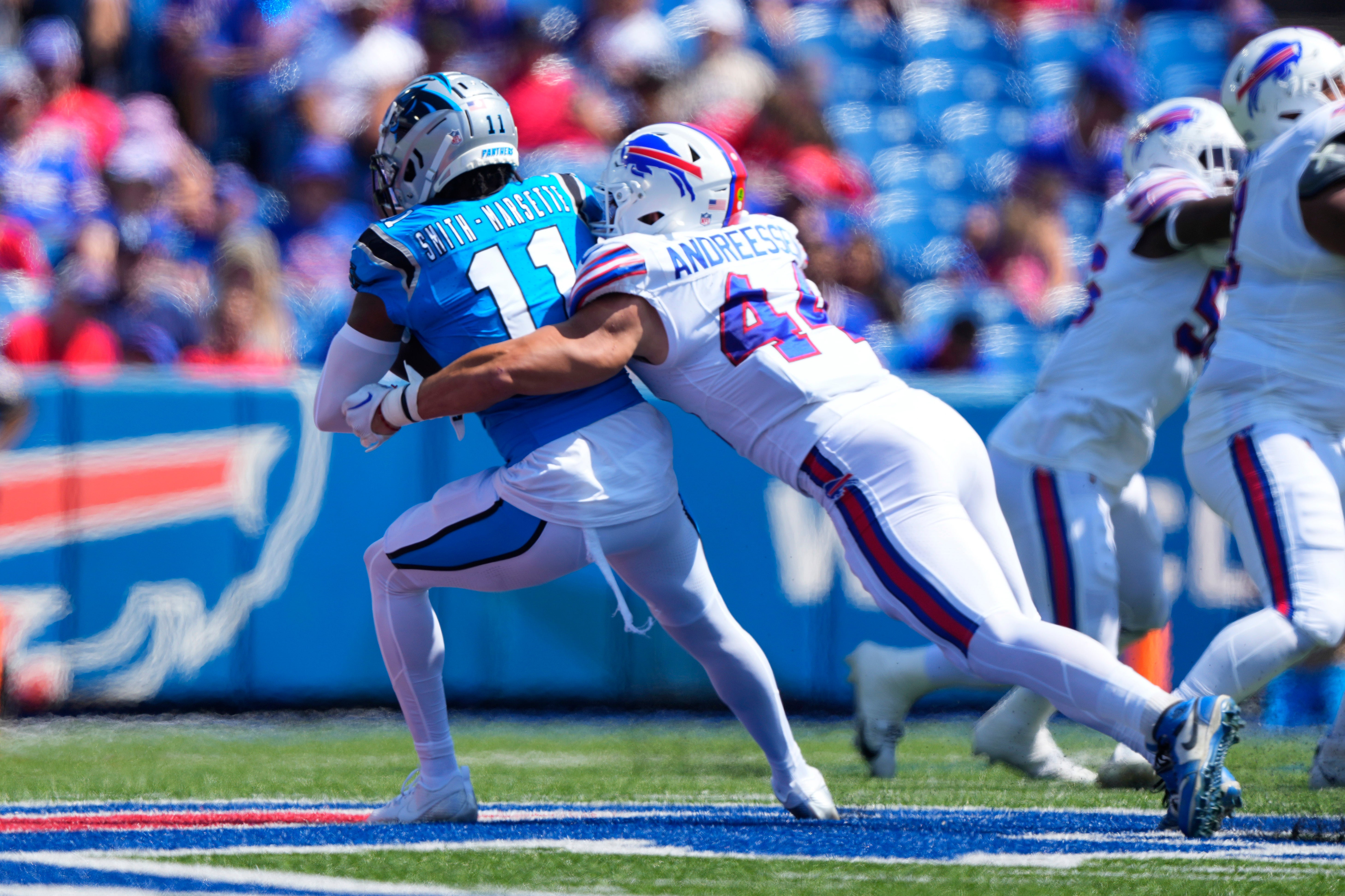 Aug 24, 2024; Orchard Park, New York, USA; Buffalo Bills linebacker Joe Andreessen (44) tackles Carolina Panthers wide receiver Ihmir Smith-Marsette (11) during the first half at Highmark Stadium.