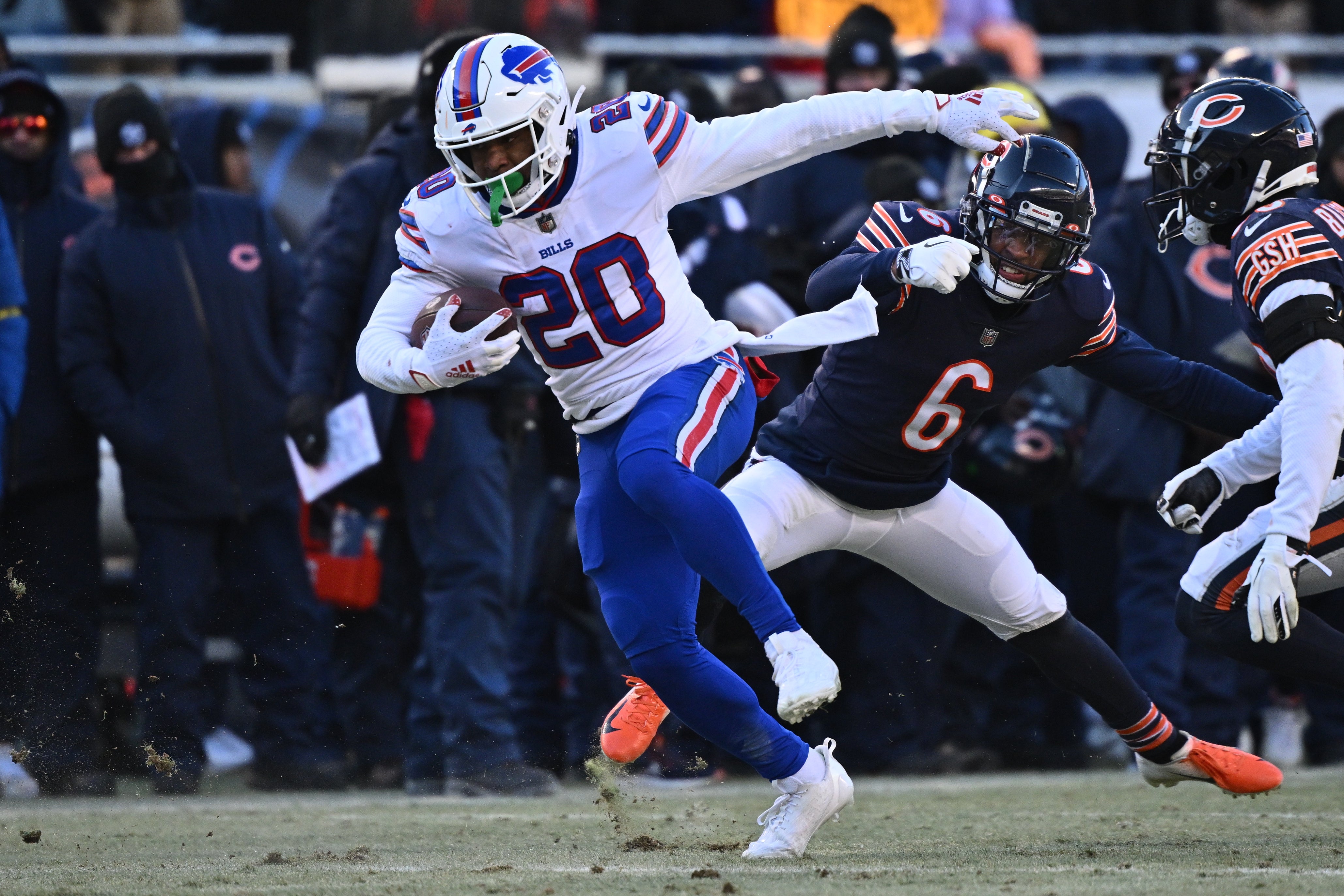 Dec 24, 2022; Chicago, Illinois, USA; Buffalo Bills running back Nyheim Hines (20) spins away from Chicago Bears defensive back Kyler Gordon (6) in the fourth quarter at Soldier Field. Buffalo defeated Chicago 35-13.