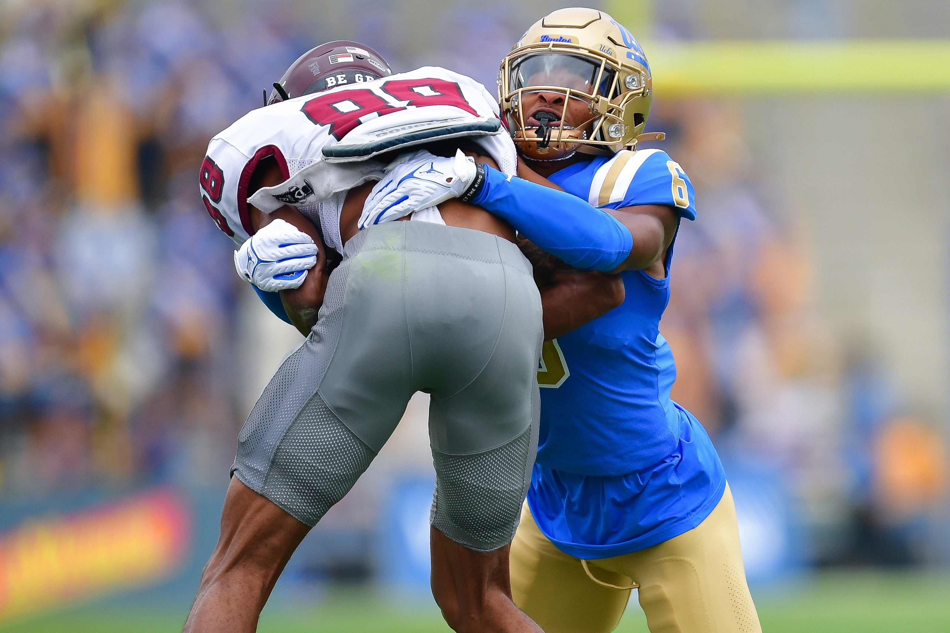 Sep 16, 2023; Pasadena, California, USA; UCLA Bruins defensive back John Humphrey (6) brings down North Carolina Central Eagles wide receiver Joaquin Davis (88) during the first half at Rose Bowl.