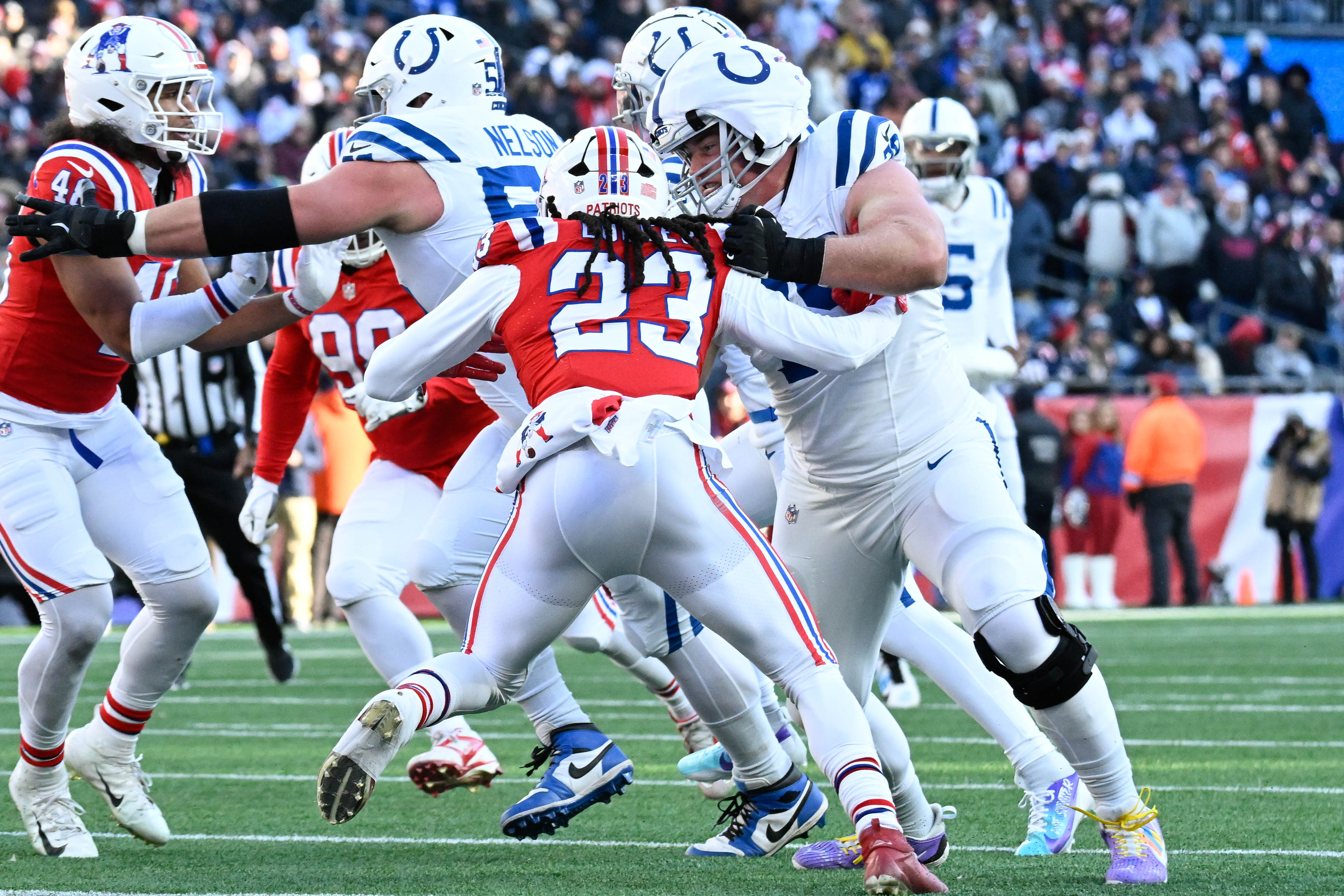 Dec 1, 2024; Foxborough, Massachusetts, USA; Indianapolis Colts offensive tackle Bernhard Raimann (79) blocks New England Patriots safety Kyle Dugger (23) during the first half at Gillette Stadium.