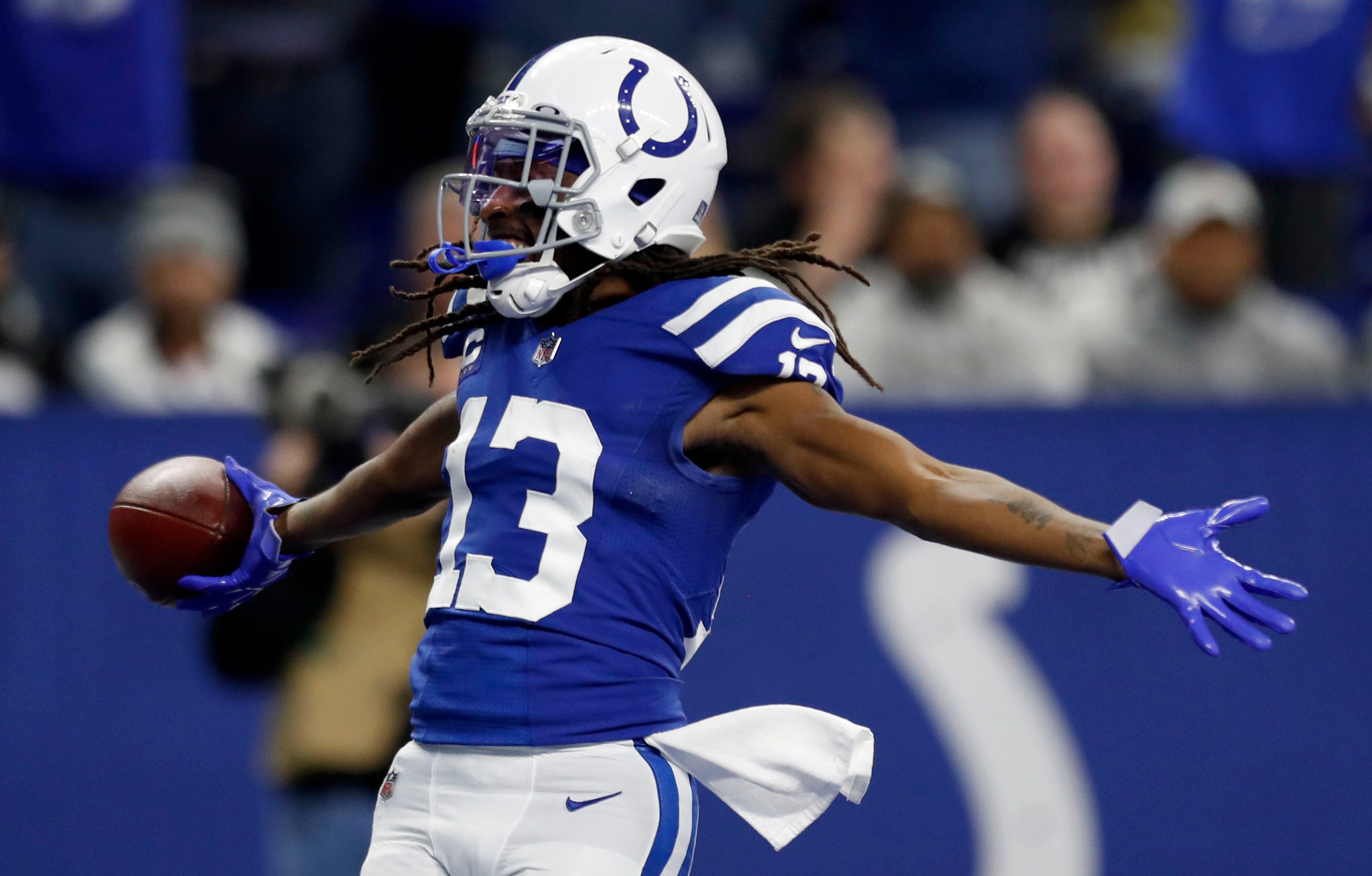 Indianapolis Colts wide receiver T.Y. Hilton (13) celebrates after catching the ball for a touchdown after it's juggled by Indianapolis Colts wide receiver Ashton Dulin (16), Las Vegas Raiders free safety Tre'von Moehrig (25) and Las Vegas Raiders cornerback Casey Hayward Jr. (29) on Sunday, Jan. 2, 2022, during a game against the Las Vegas Raiders at Lucas Oil Stadium in Indianapolis.
