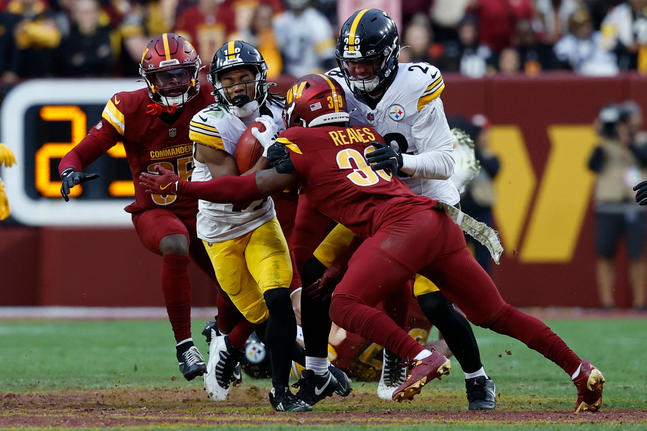 Nov 10, 2024; Landover, Maryland, USA; Pittsburgh Steelers wide receiver Calvin Austin III (19) is tackled after making a catch by Washington Commanders safety Jeremy Reaves (39) at Northwest Stadium.