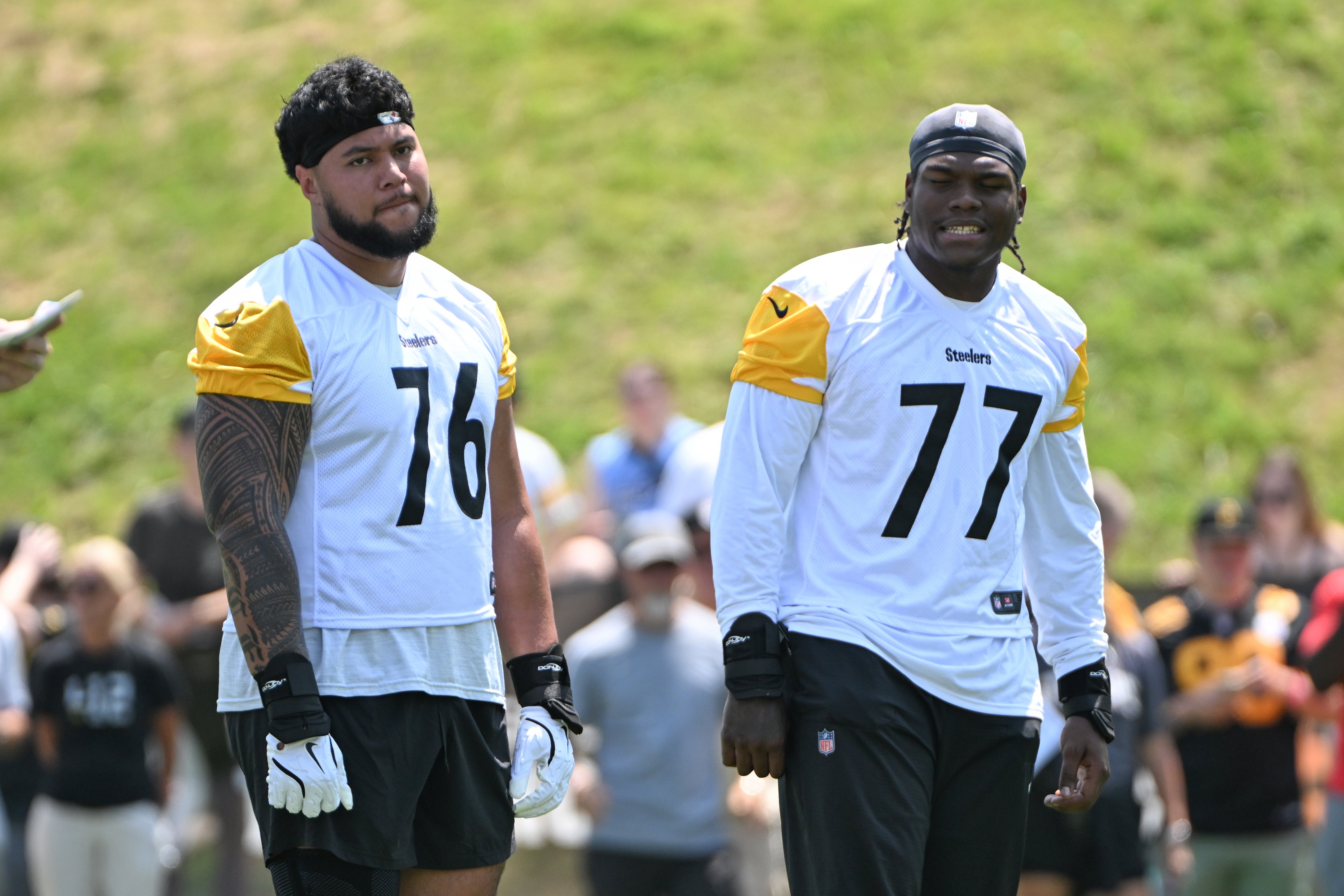 Jul 25, 2025; Pittsburgh, PA, USA; Pittsburgh Steelers offensive tackle Troy Fautanu (76) and offensive tackle Broderick Jones (77) participate in drills during training camp at Saint Vincent College. 