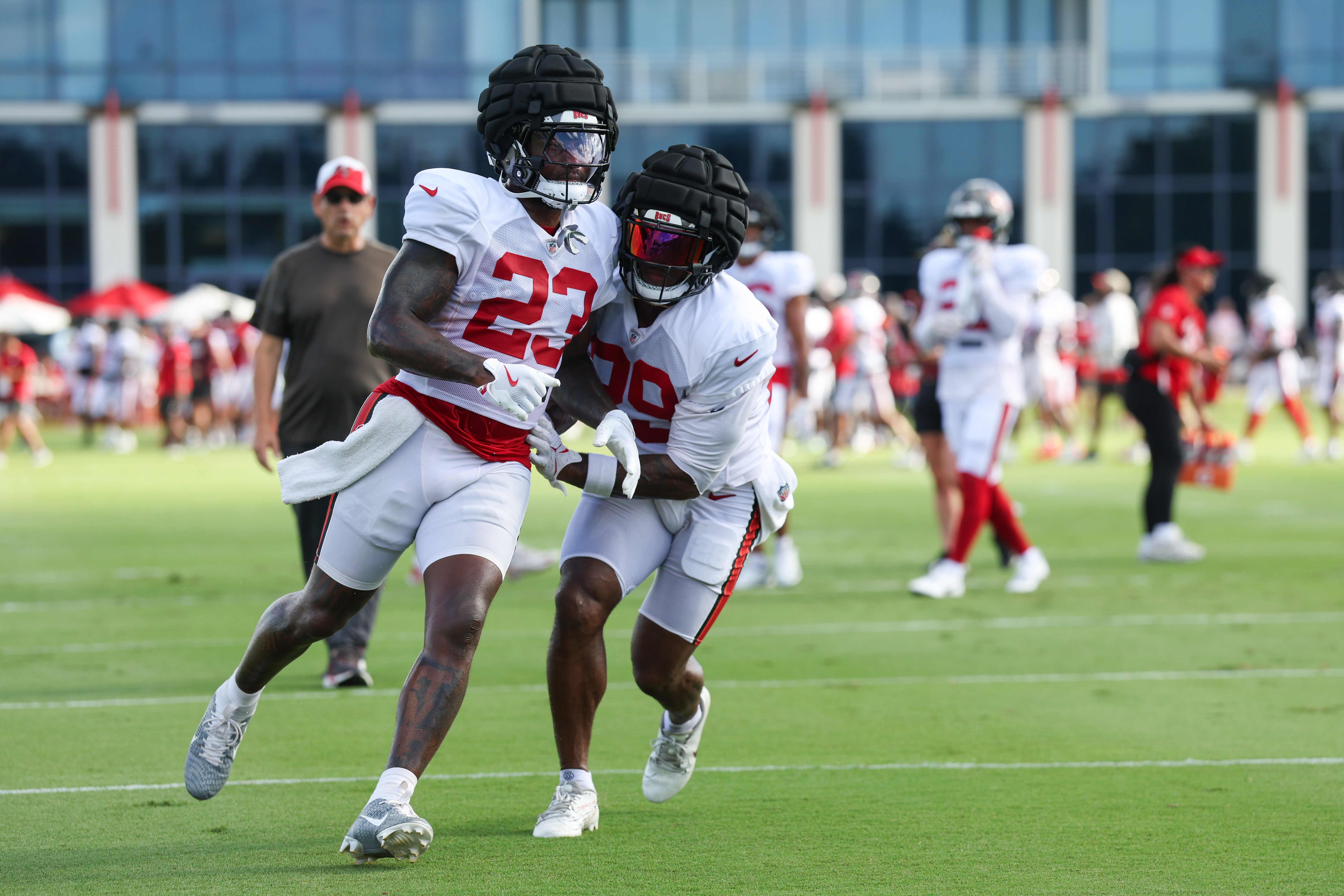 Jul 31, 2025; Tampa, FL, USA; Tampa Bay Buccaneers safety Tykee Smith (23) and safety Christian Izien (29) participate in training camp at AdventHealth Training Center. 