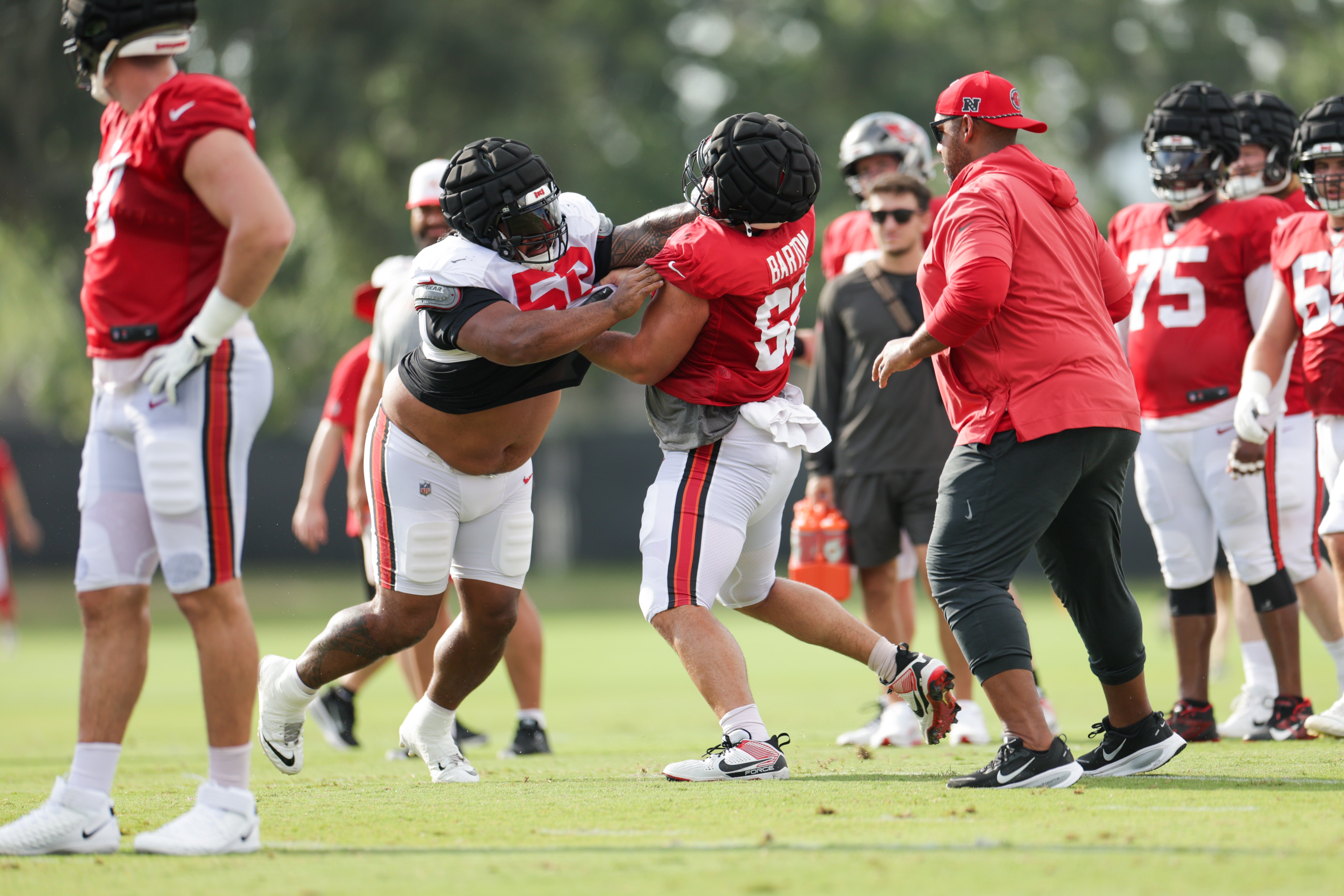 Aug 1, 2025; Tampa, FL, USA; Tampa Bay Buccaneers defensive tackle Vita Vea (50) and center Graham Barton (62) participate in training camp at AdventHealth Training Center. 