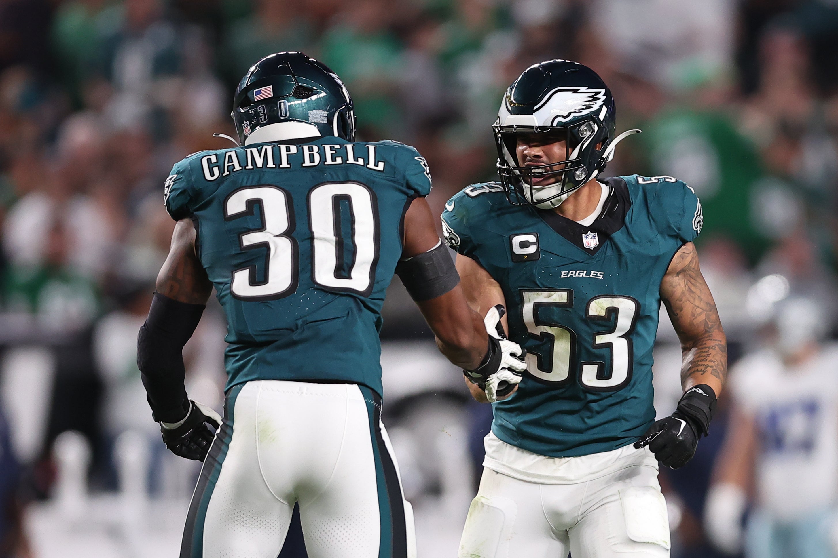 Philadelphia Eagles linebacker Zack Baun (53) reacts with linebacker Jihaad Campbell (30) in a game against the Dallas Cowboys at Lincoln Financial Field.