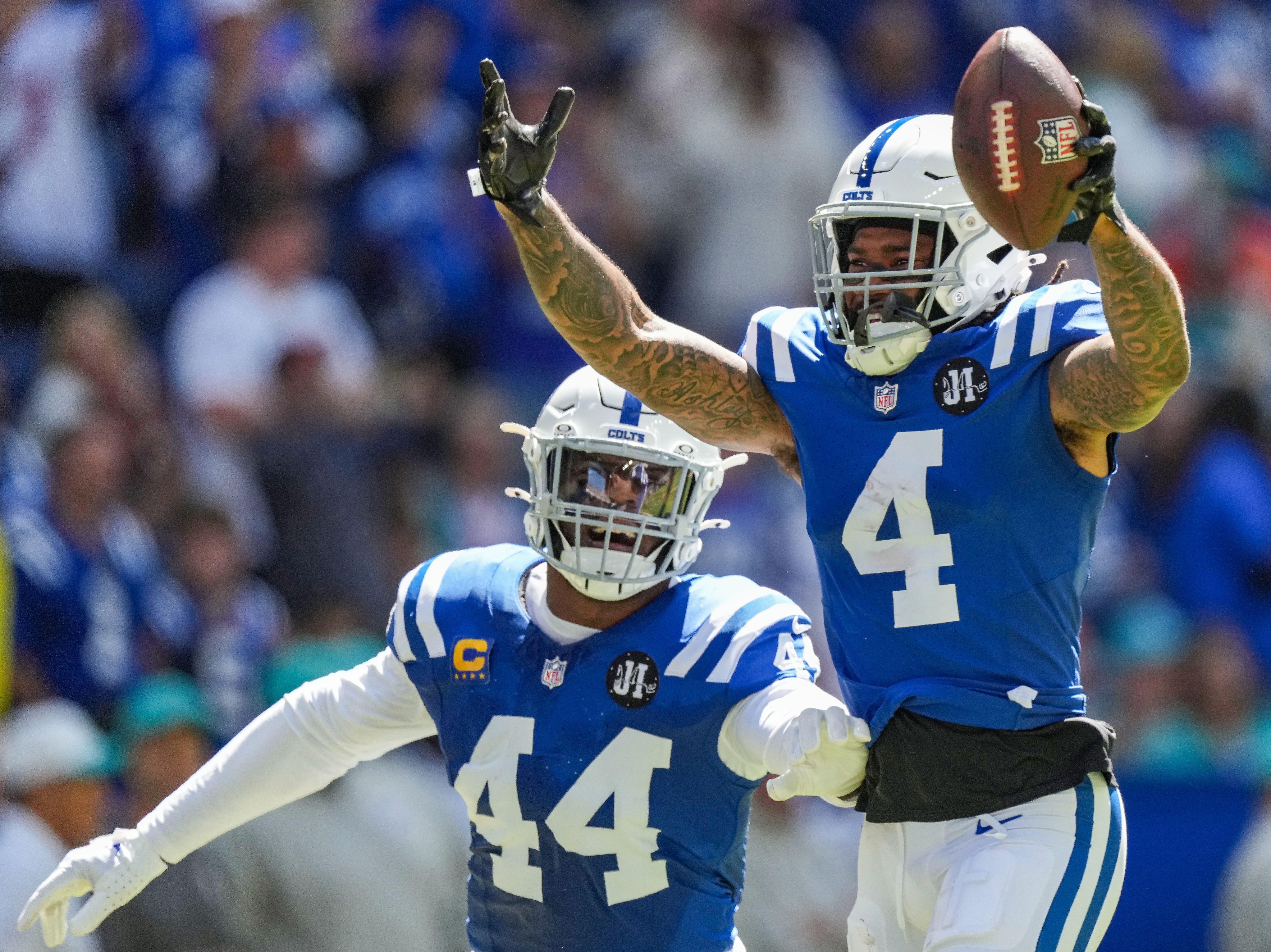Colts CB Xavien Howard celebrates a fumble recovery with LB Zaire Franklin