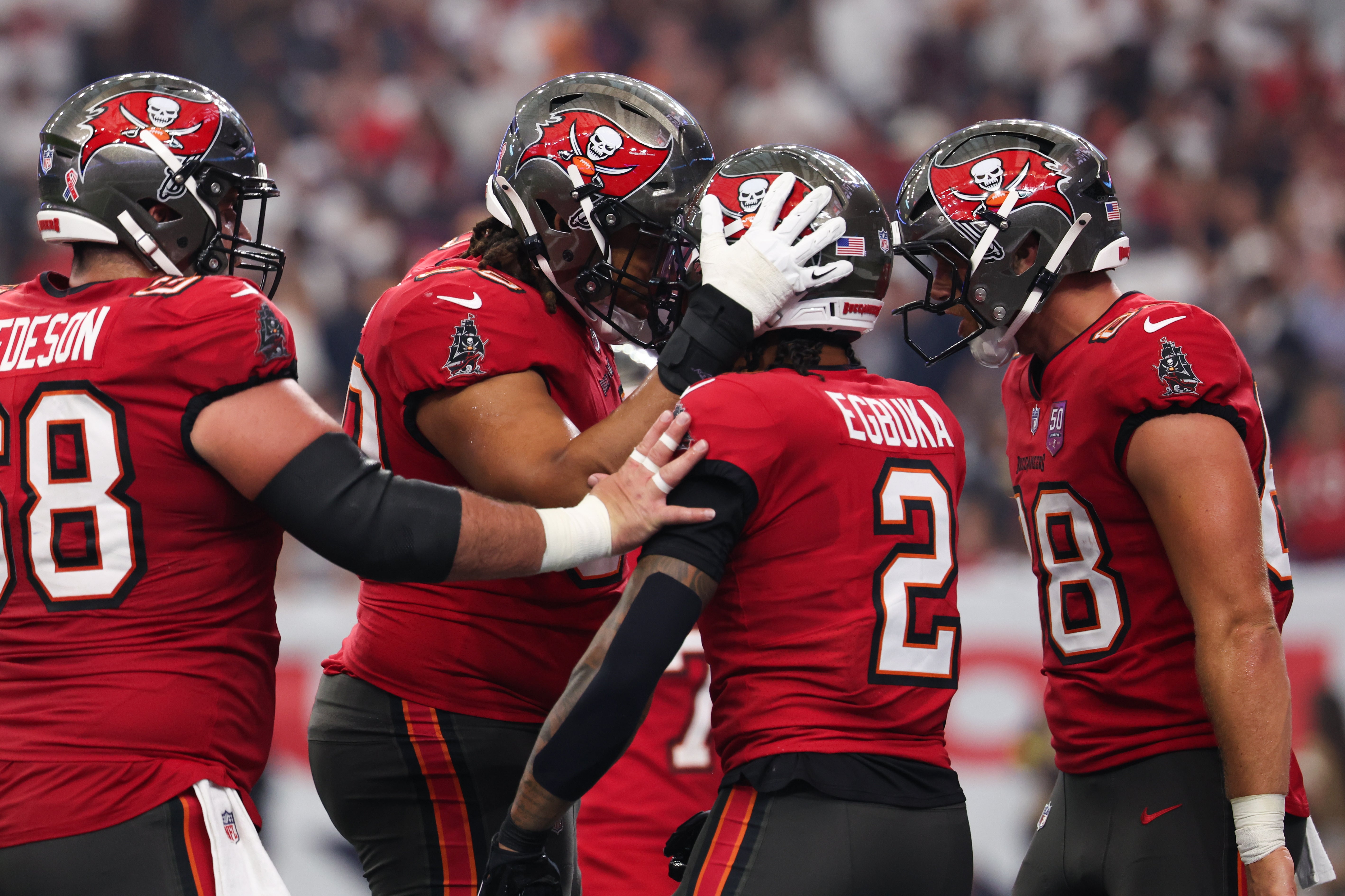 Sep 15, 2025; Houston, Texas, USA; Tampa Bay Buccaneers wide receiver Emeka Egbuka (2) celebrates after scoring a touchdown during the second quarter against the Houston Texans at NRG Stadium.