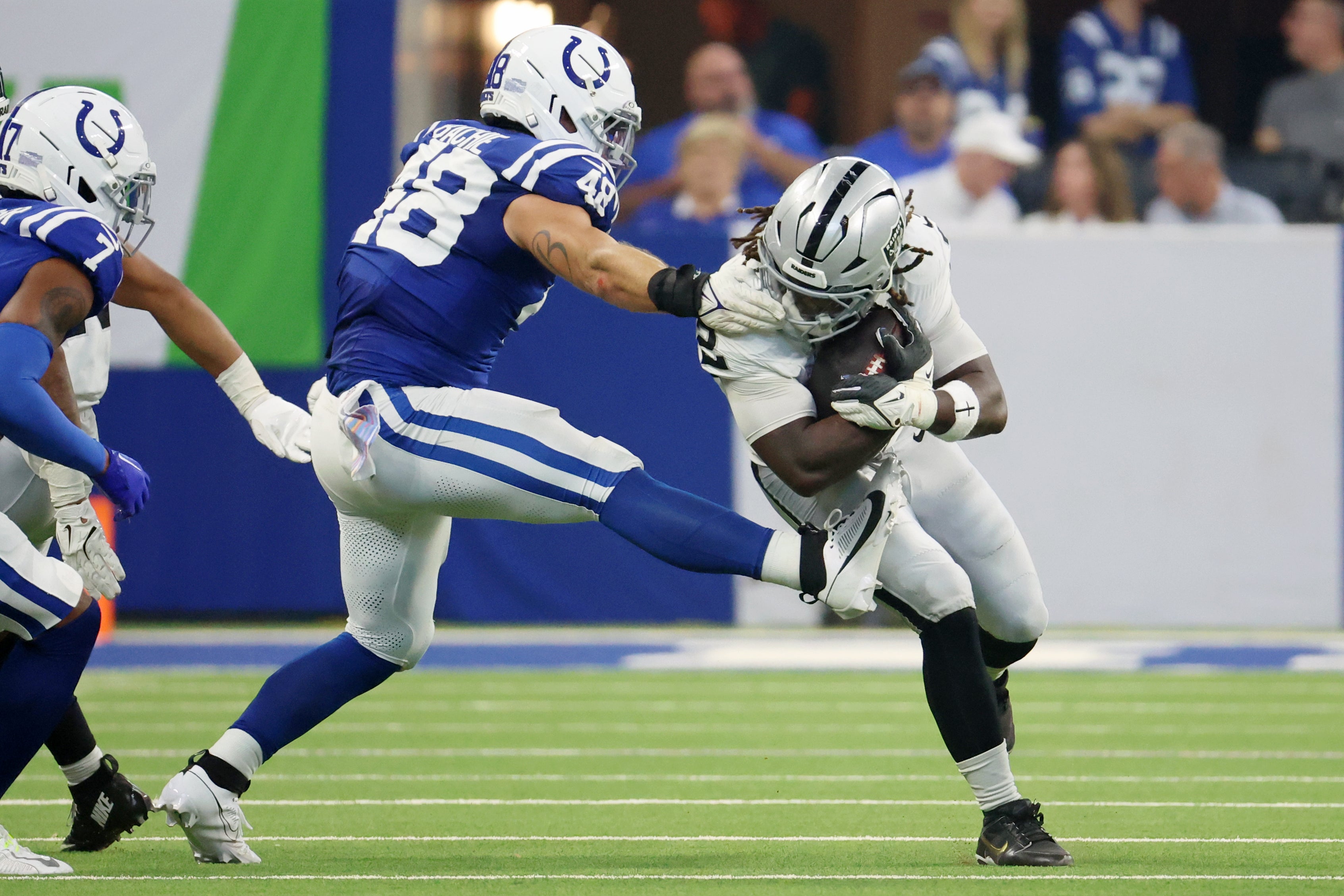 Colts LB Joe Bachie attempts to rip Raiders player