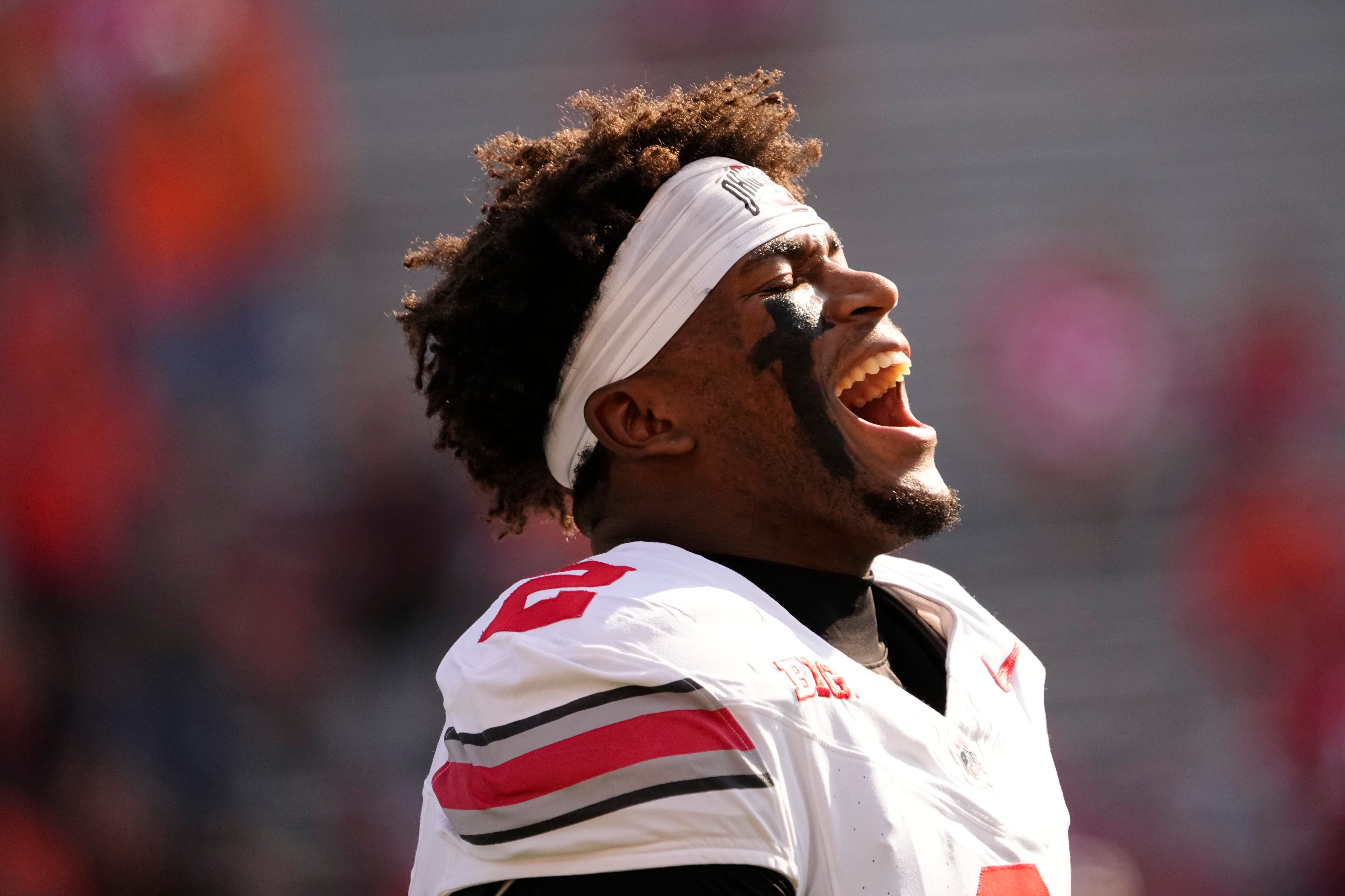 Ohio State Buckeyes defensive back Caleb Downs (2) yells during warm ups prior to the NCAA football game against the Illinois Fighting Illini at Gies Memorial Stadium in Champaign on Oct. 11, 2025.