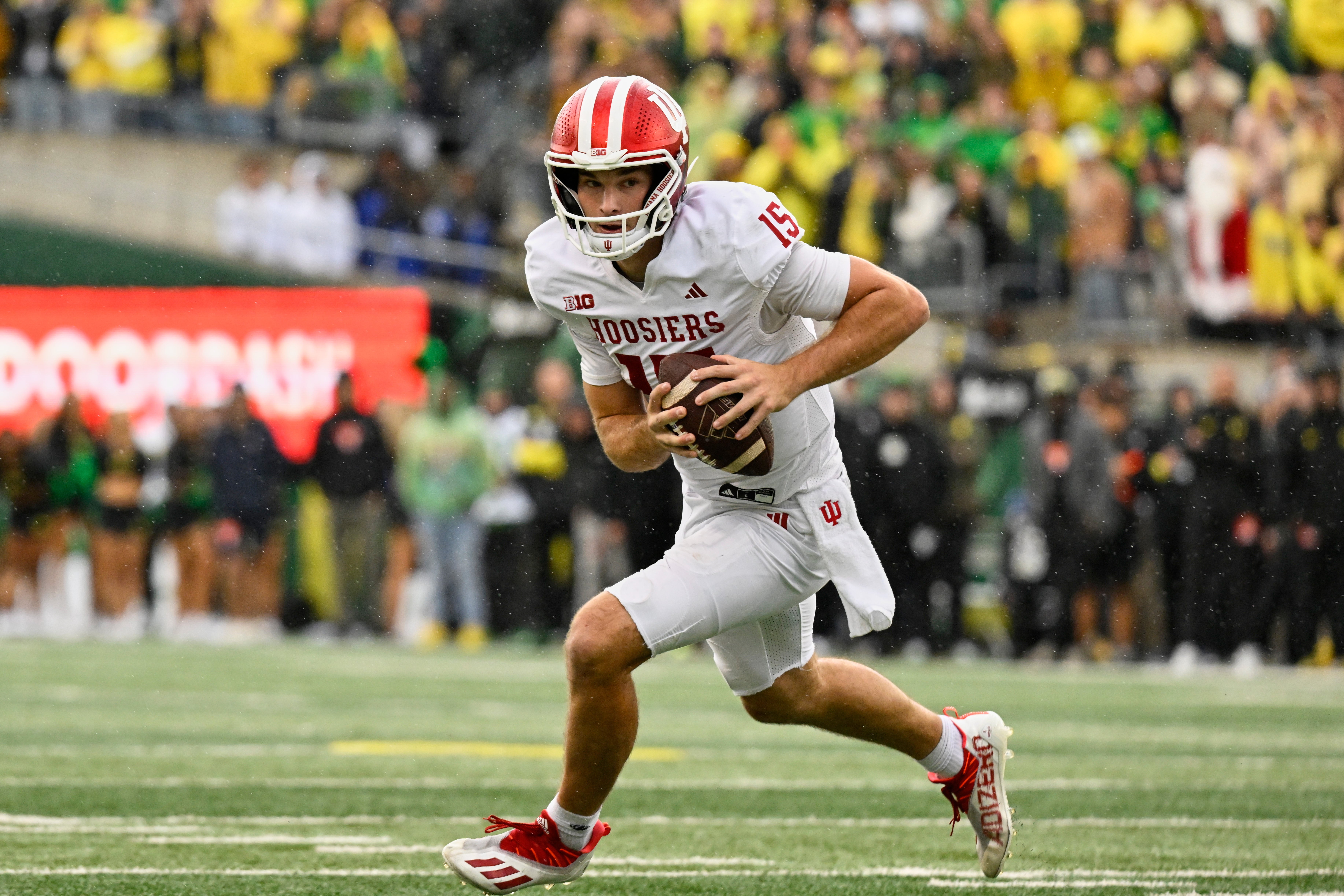 Oct 11, 2025; Eugene, Oregon, USA; Indiana Hoosiers quarterback Fernando Mendoza (15) runs with the ball against the Oregon Ducks during the fourth quarter at Autzen Stadium.