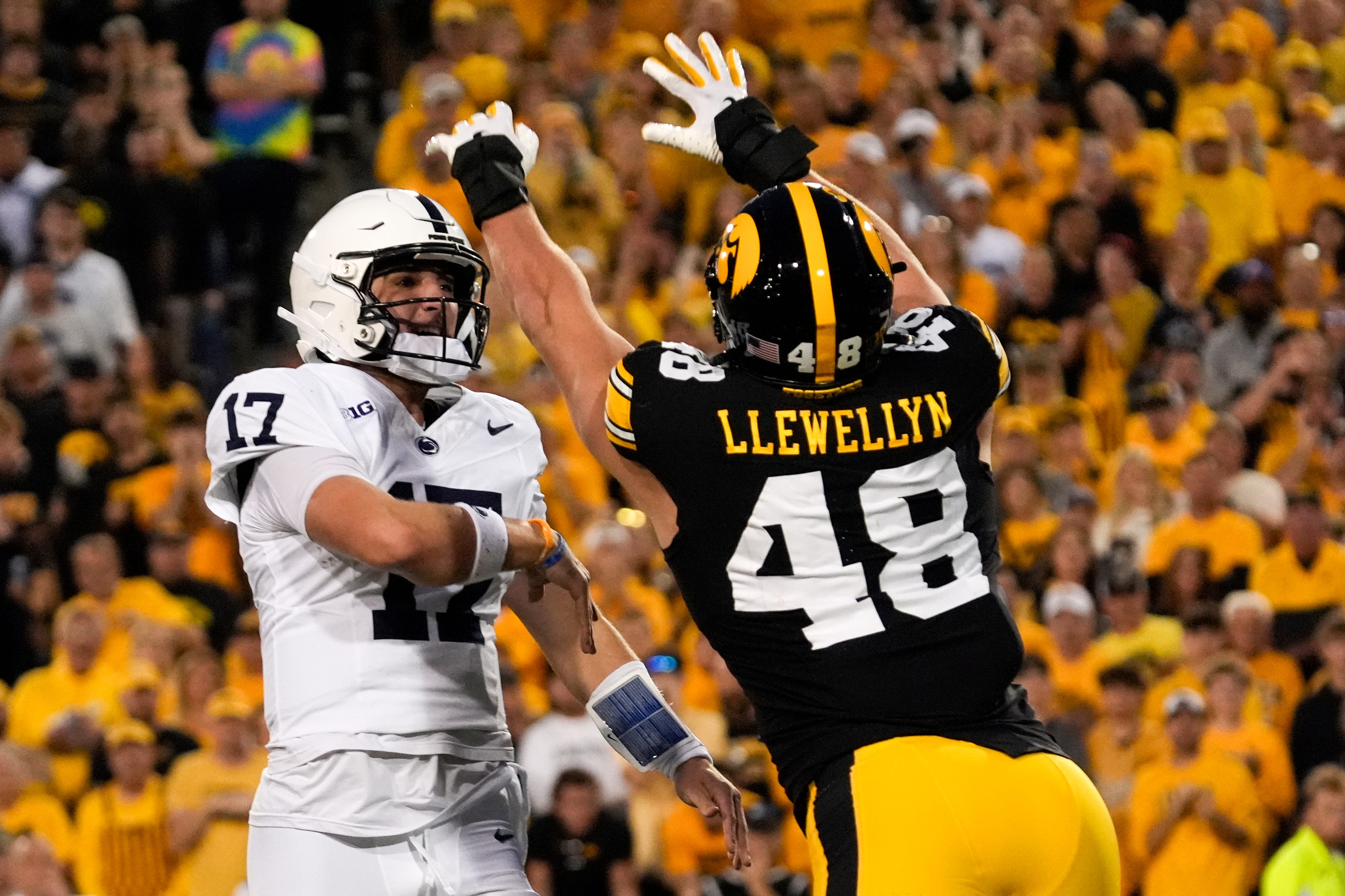 Iowa Hawkeyes defensive end Max Llewellyn (48) pressures Penn State Nittany Lions quarterback Ethan Grunkemeyer (17) during a college football game Oct. 18, 2025 at Kinnick Stadium in Iowa City, Iowa.