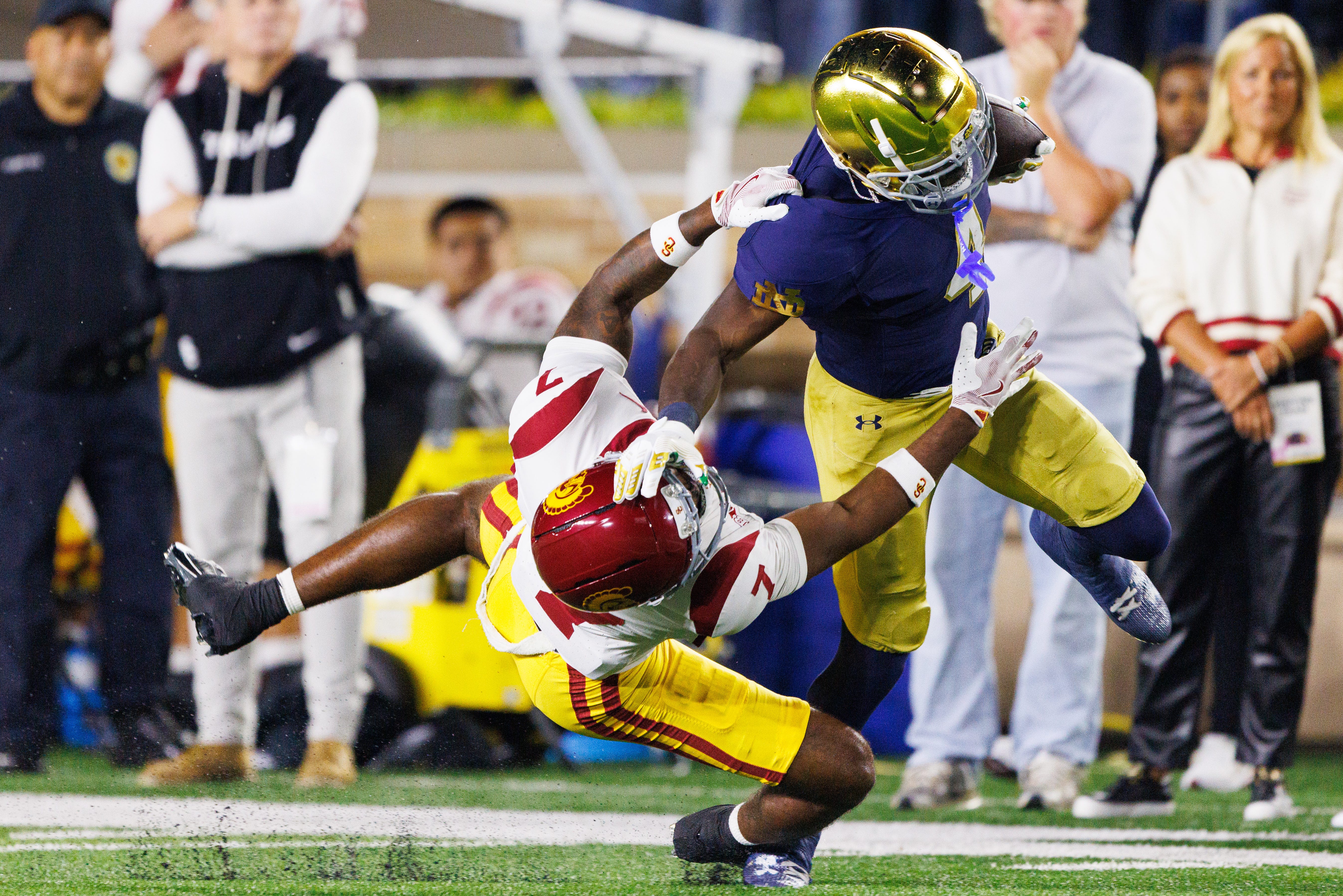 Notre Dame running back Jeremiyah Love (4) stiff-arms Southern California safety Kamari Ramsey (7) in the first half of a NCAA football game at Notre Dame Stadium on Saturday, Oct. 18, 2025, in South Bend.