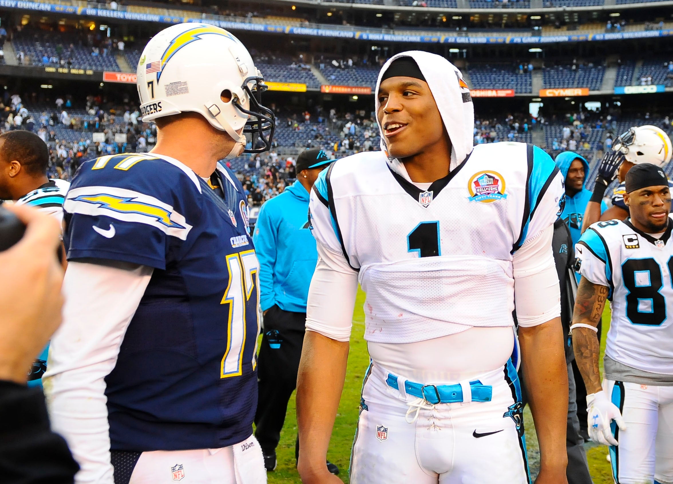 Cam Newton and Philip Rivers speak after a game