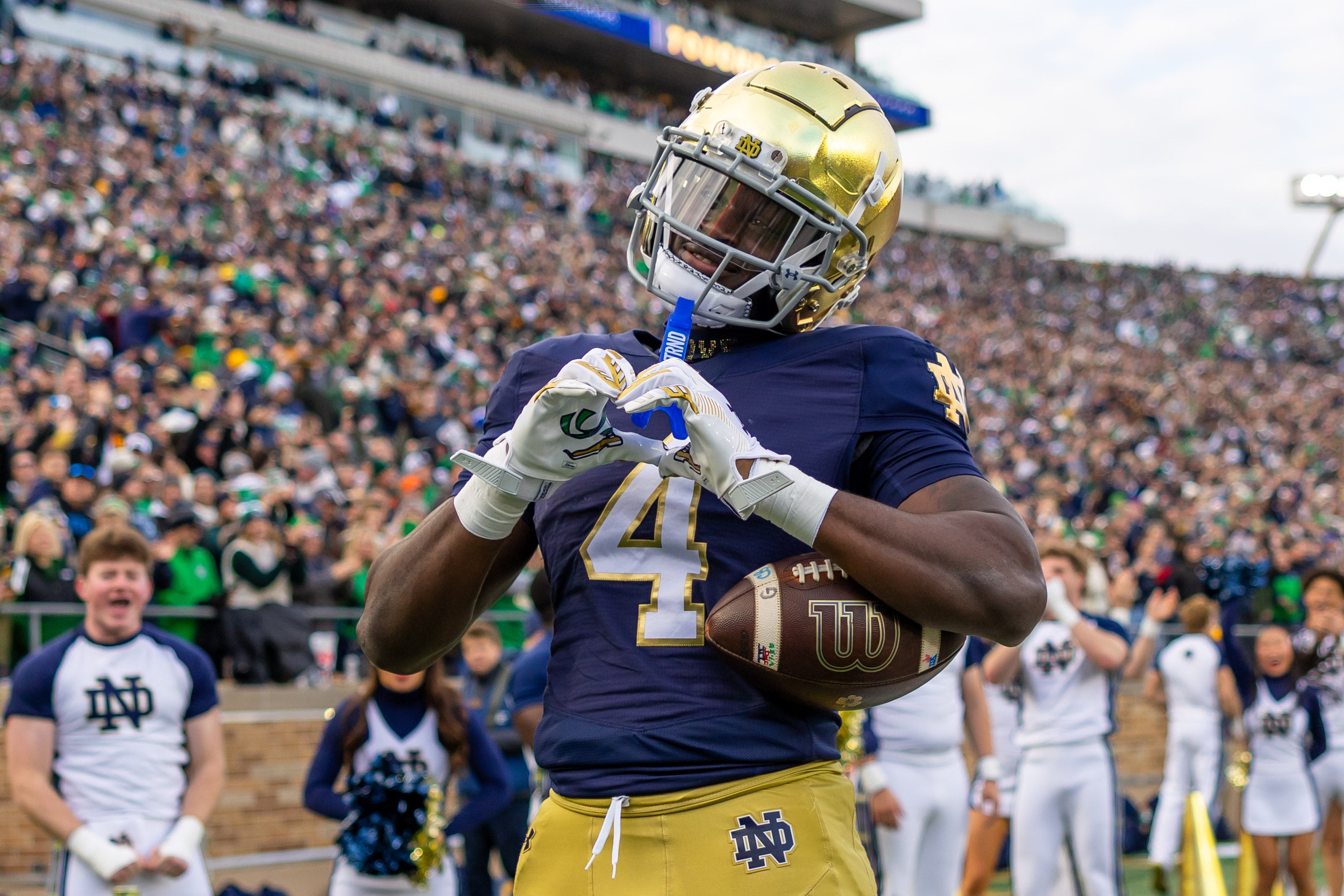 Nov 22, 2025; South Bend, Indiana, USA; Notre Dame Fighting Irish running back Jeremiyah Love (4) celebrates scoring against the Syracuse Orange during the first half at Notre Dame Stadium. Mandatory Credit: Michael Caterina-Imagn Images